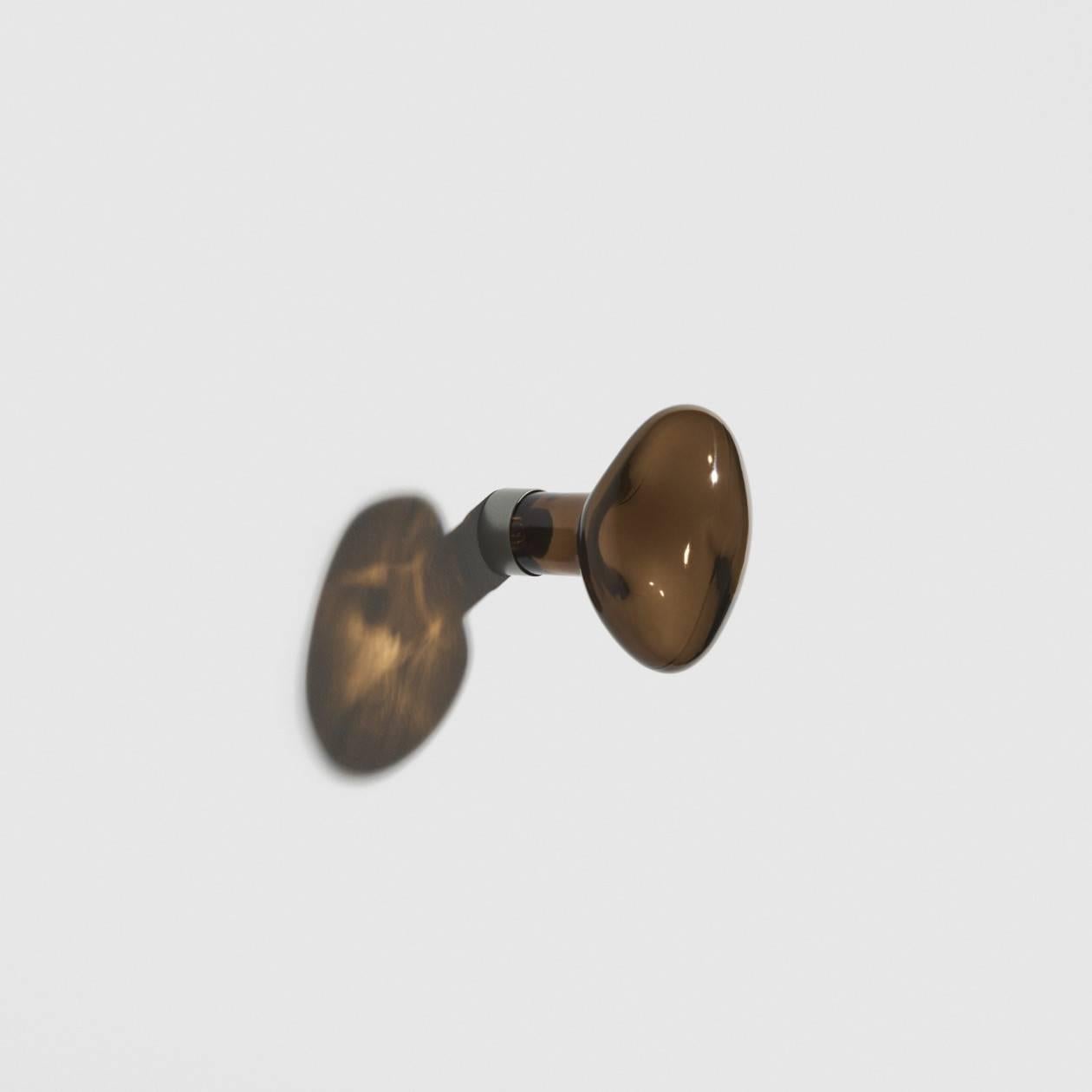 Hand blown in a mould, the bubble coat cook  come in two sizes and set up in the same manner as soap bubbles, in unpredictable forms. The result rejuvenates the home by adding colourful yet transparent touches. The designers have created a strong
