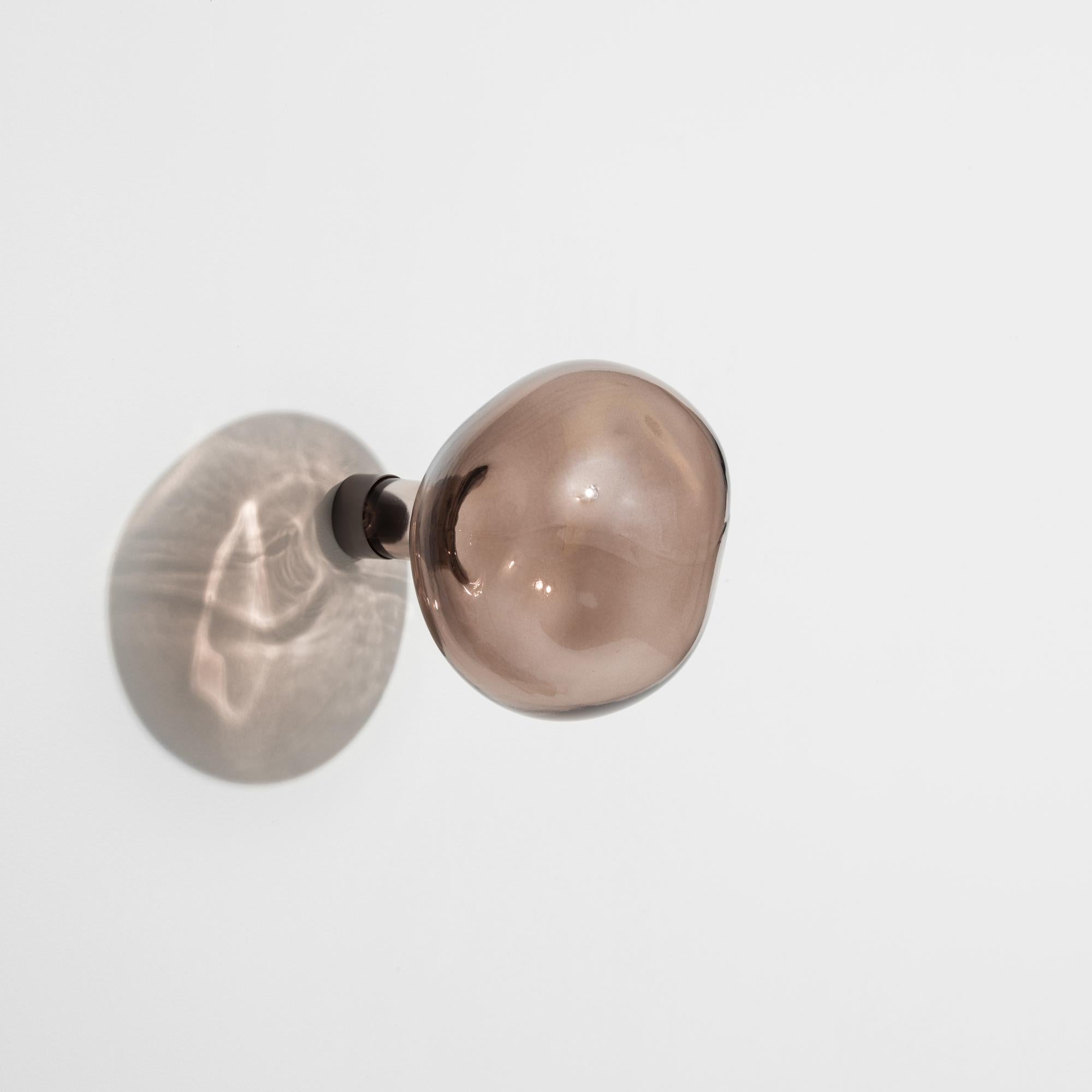 two marbles in a hanger