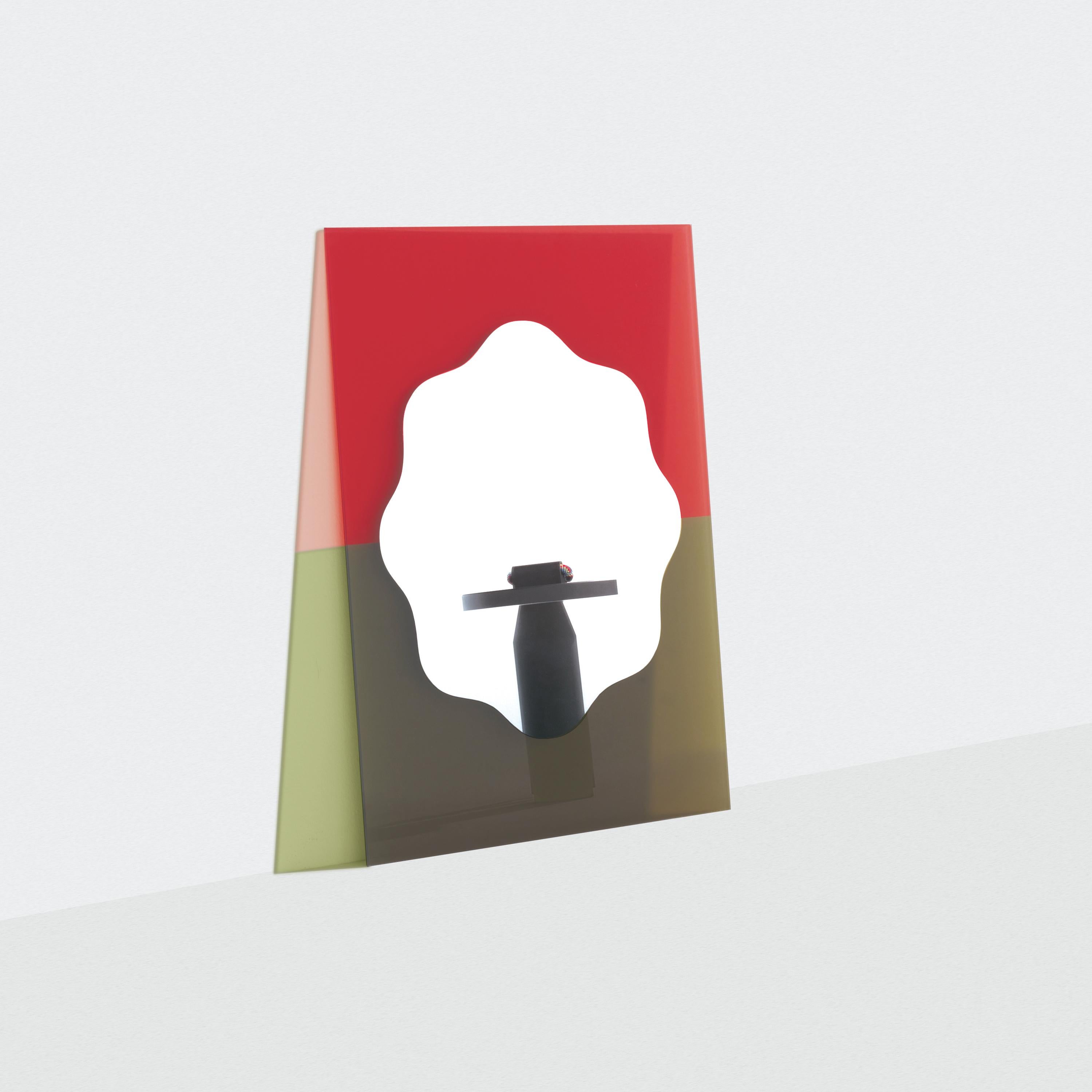 The Small Wander Mirror was inspired by the arts of painting and collage by playfully using shapes and colors to create a bright and dynamic look. The rounded mirror is backed by a translucent colored glass panel, which will cast a subtle halo on
