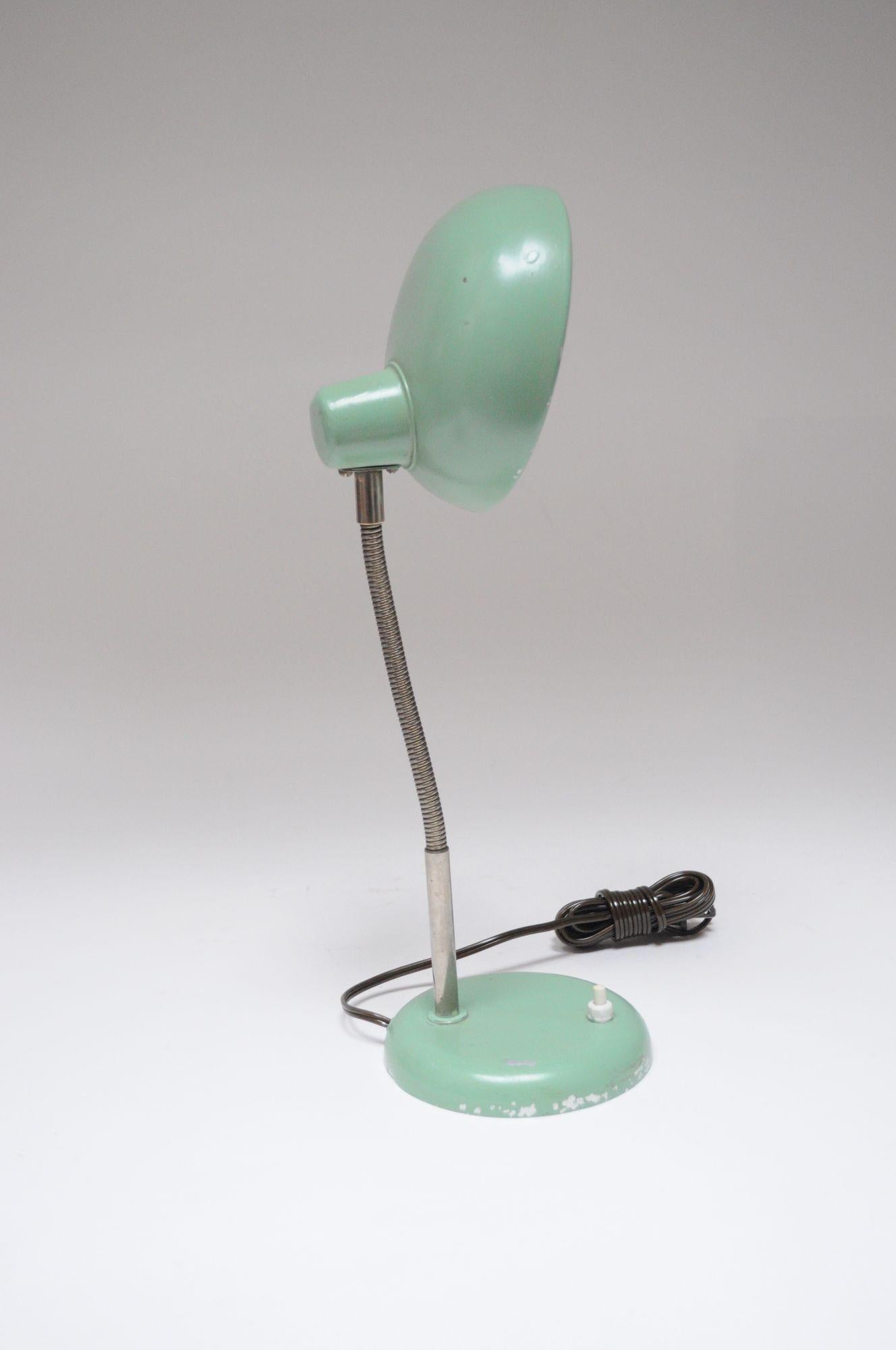 Mid-20th Century Industrial desk/table lamp in the style of Christian Dell (ca. 1950, Germany).
Petite form with gooseneck and adjustable shade.
Mint green paint is of the period, but not original, evidenced by its thick, uneven application