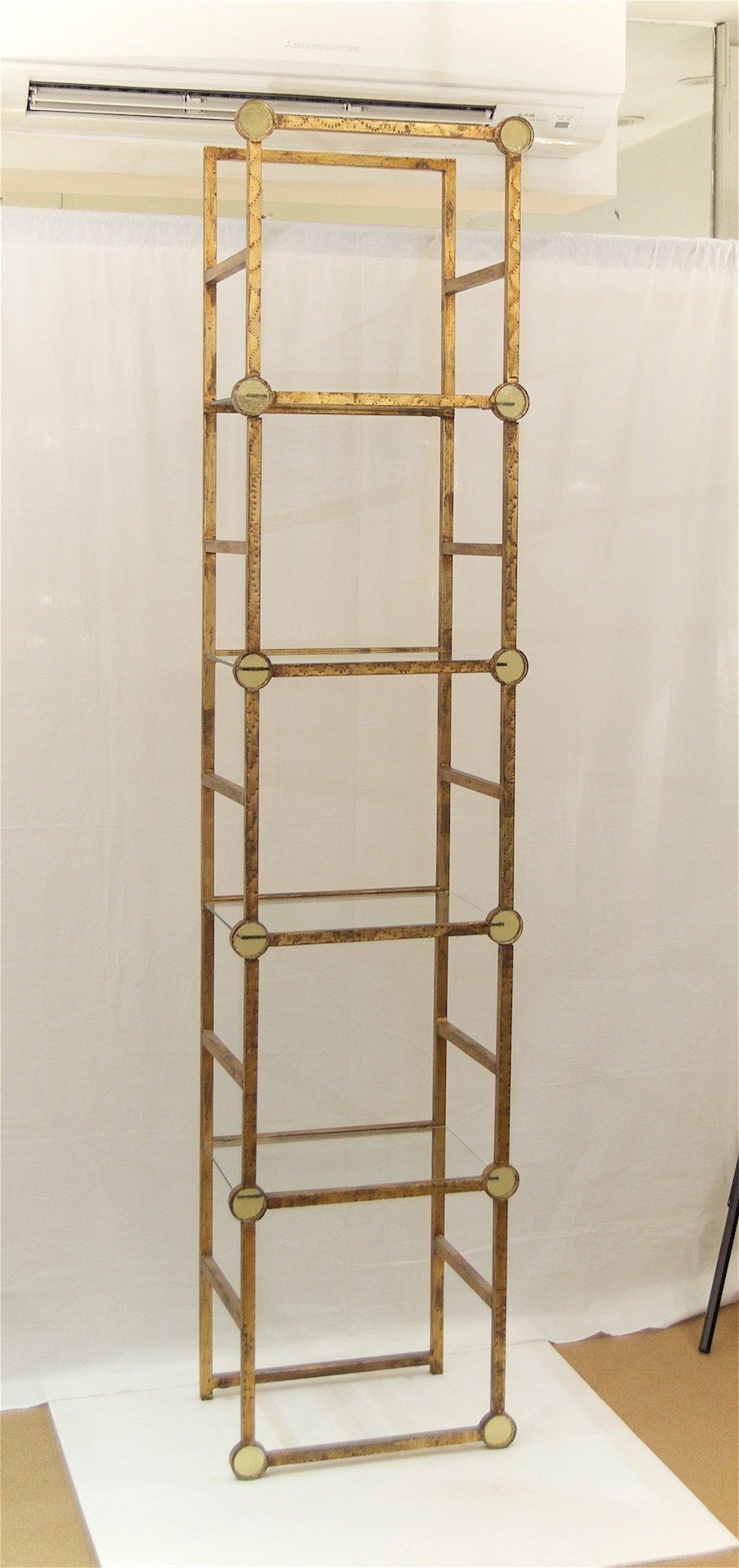 Italy, 1960s

This well sized étagère is perfect for small spaces. The gilt frame has circular amber glass roundel details and six glass shelves.

Please note, additional identically designed étagère in larger (triple) width also