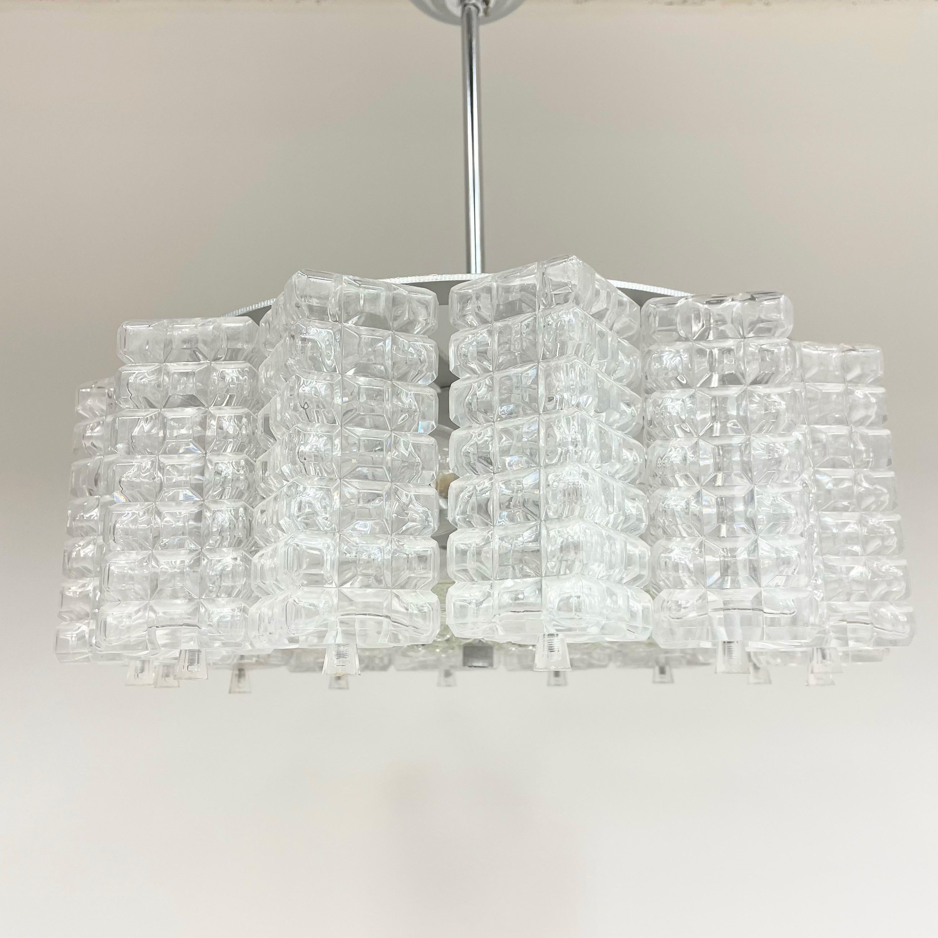 Beautiful and rare chandelier or pendant light by Austrolux. An original mid-century vintage piece manufactured in the 1960s. It is made of metal, a blown glass played and depression glass cubes / Quarters. The Fixture requires 5 European E14 / 110
