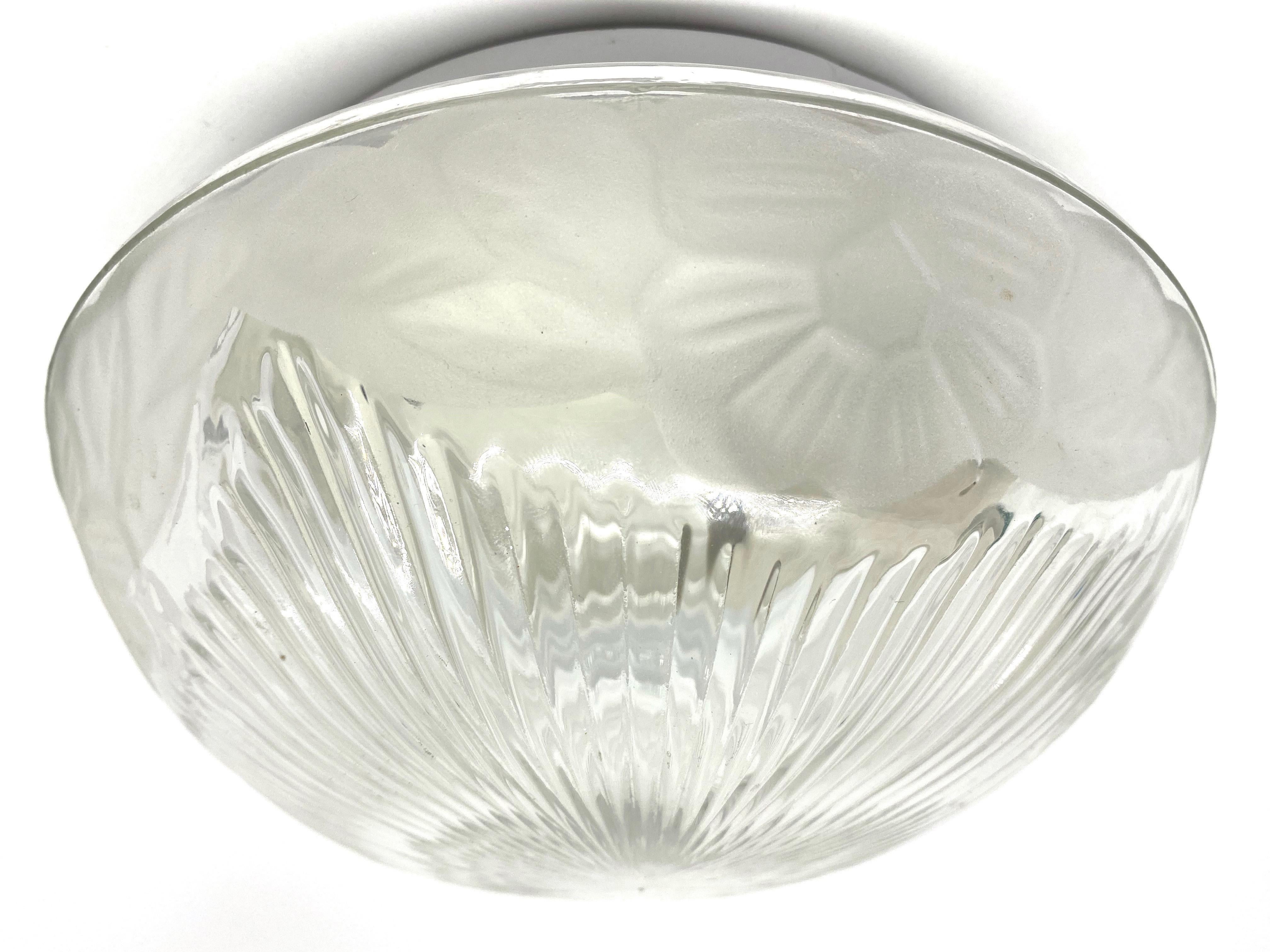 A beautiful flush mount by a German Lighting manufactory. Gorgeous textured glass flush mount with metal fixture. The fixture requires one European E27 Edison or medium bulb up to 60 watts.