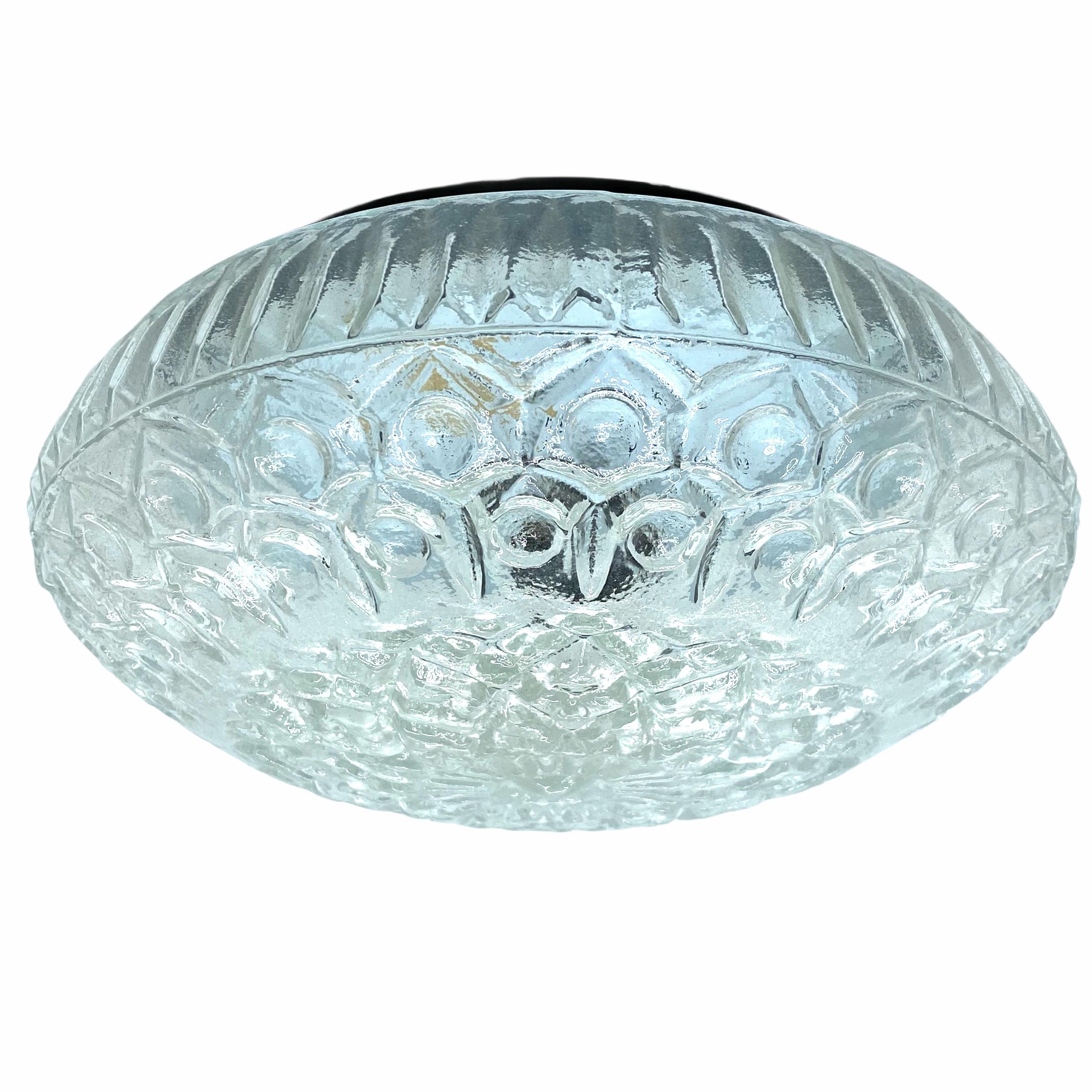 A beautiful flush mount by Massive Leuchten, Germany. Gorgeous textured glass flush mount with metal fixture. The fixture requires one European E27 Edison or medium bulb up to 60 watts.