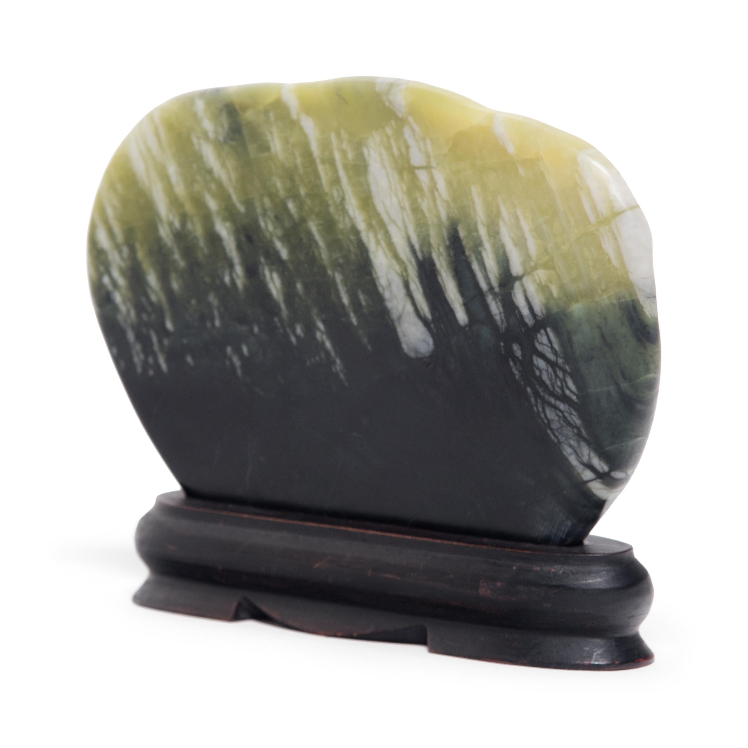 A well-chosen stone is a resting place for the mind, inspiring calm and contemplation. Marked by currents of jadeite, moss agate, and serpentine, this petite greenery stone evokes the grandeur of nature with a beautiful pattern of light to dark.