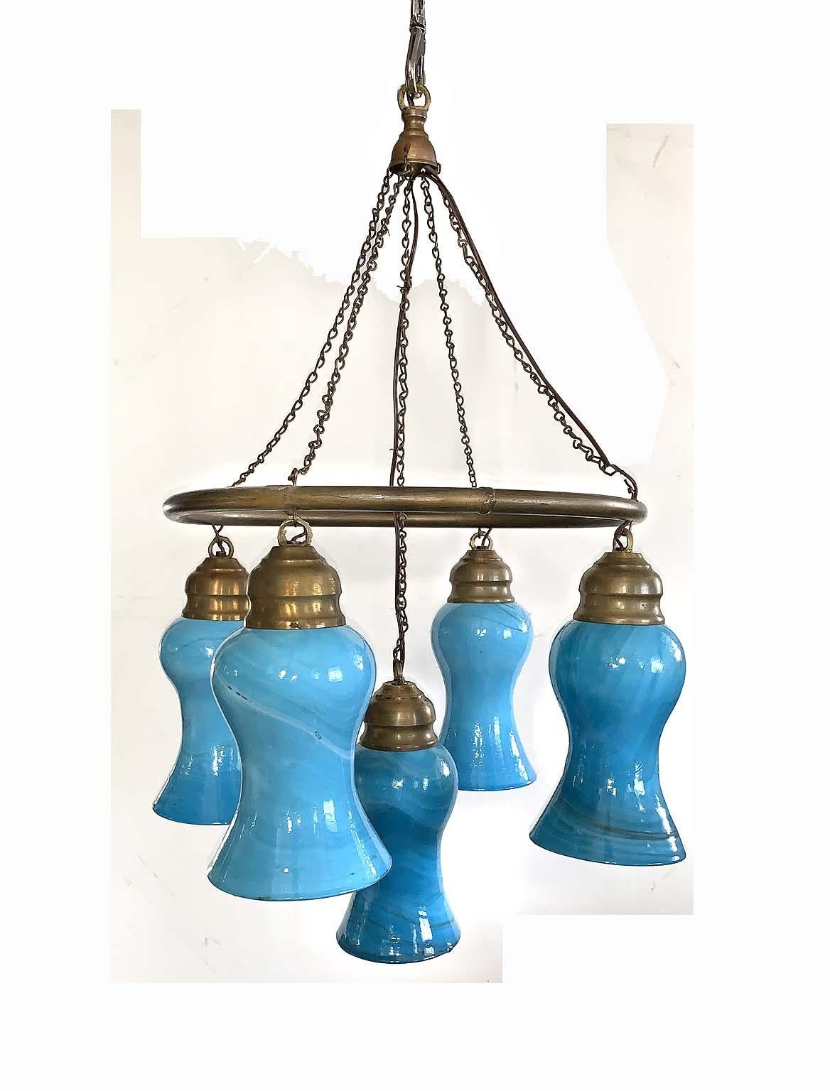 Amazing Egyptian glass chandelier. Five drop large hand blown blue glass with a brushed brass ring and chain. Amazing look and can be custom made in multiple sizes and colors. In the world of original lighting you will not find many options of this