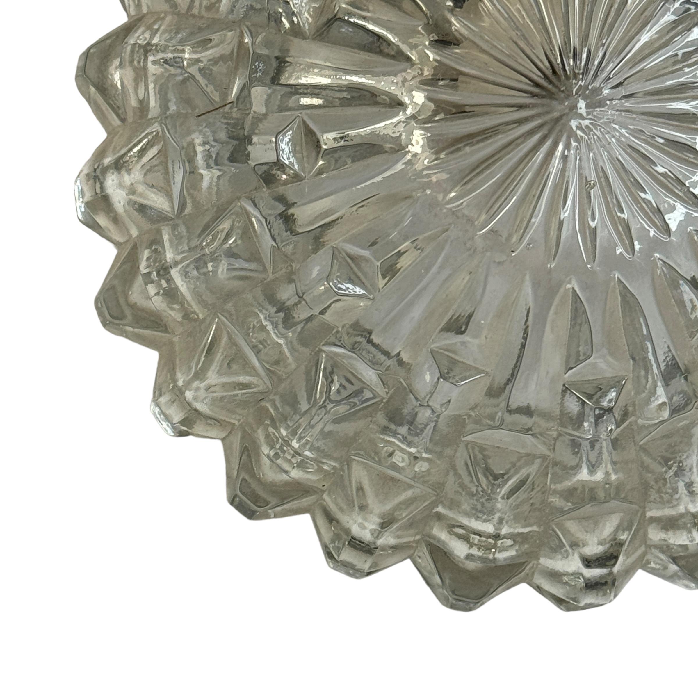 Petite flush mount manufactured by RZB Leuchten. It is a clear glass on a metal frame. The fixture has one European style E27 socket. The Fixture requires one European E27 / 110 Volt Edison bulb, up to 60 watts. A nice wall lamp for your entry hall