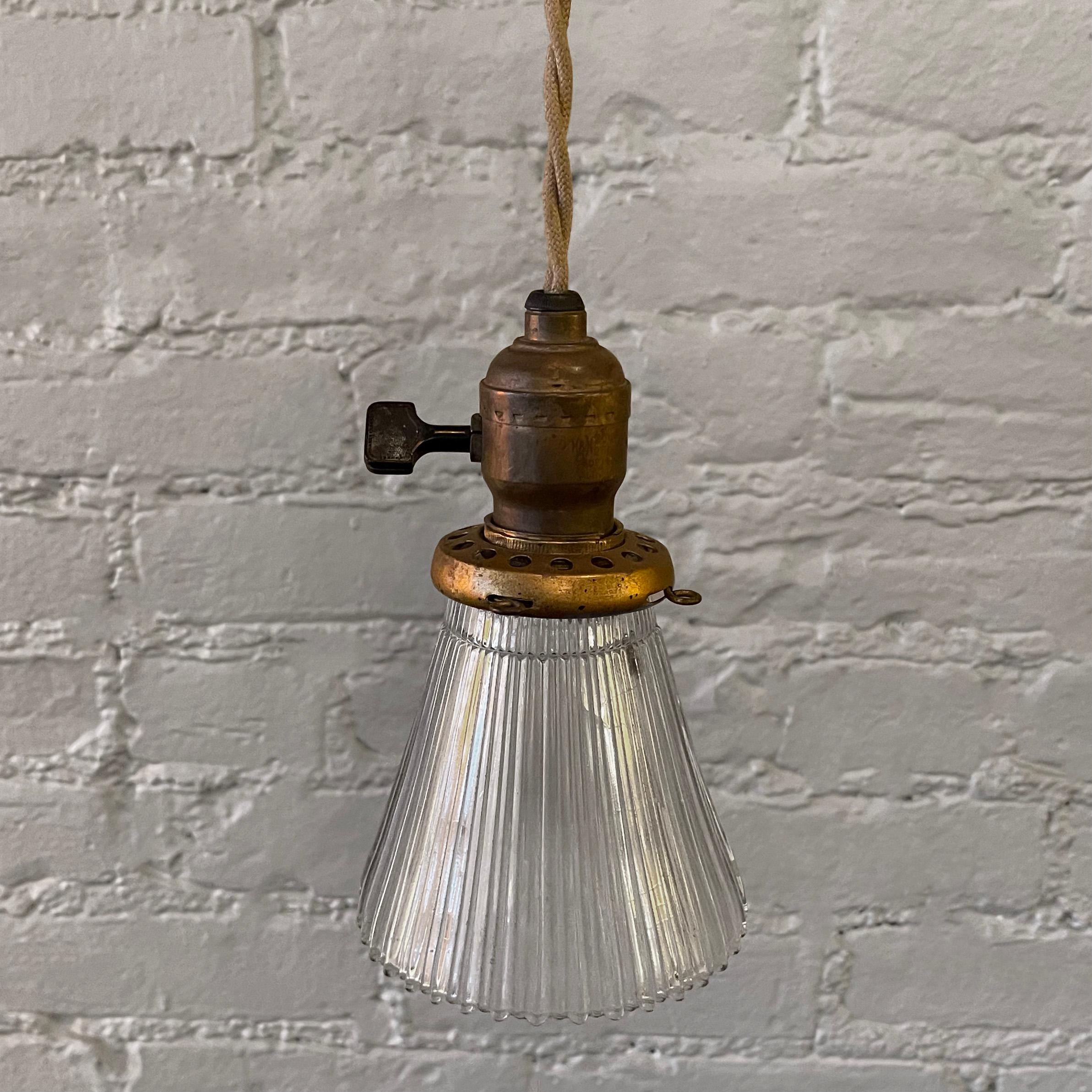 Petite, industrial pendant light with a cut glass cone shade and brass paddle switch hardware is newly wired with 36 inches of braided beige cord.