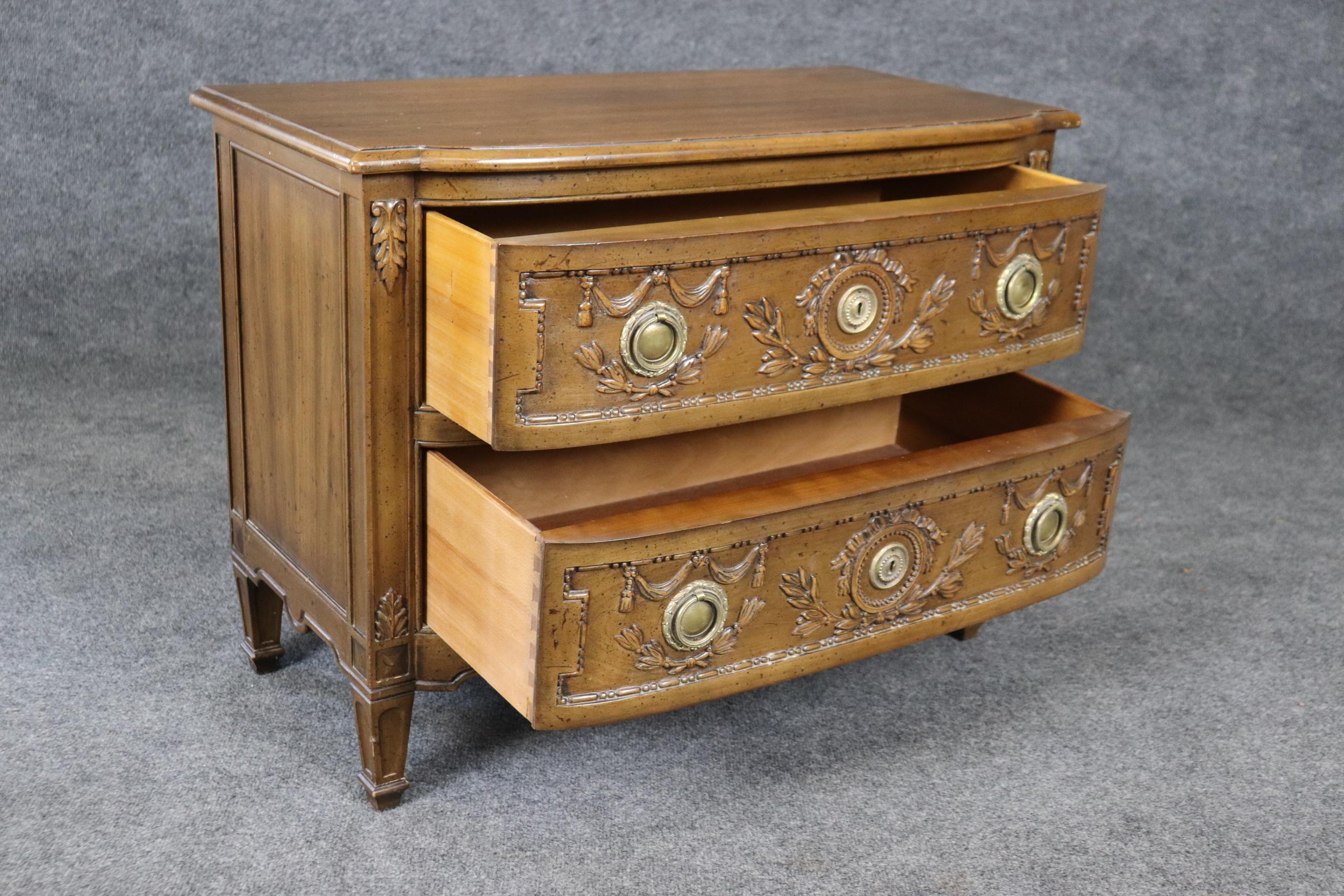 This is a gorgeous antique-looking intentionally distressed nightstand by one of America's most noteworthy and quality makers, Henredon. The dresser looks antique and was designed to look that way. The condition is original and good with no