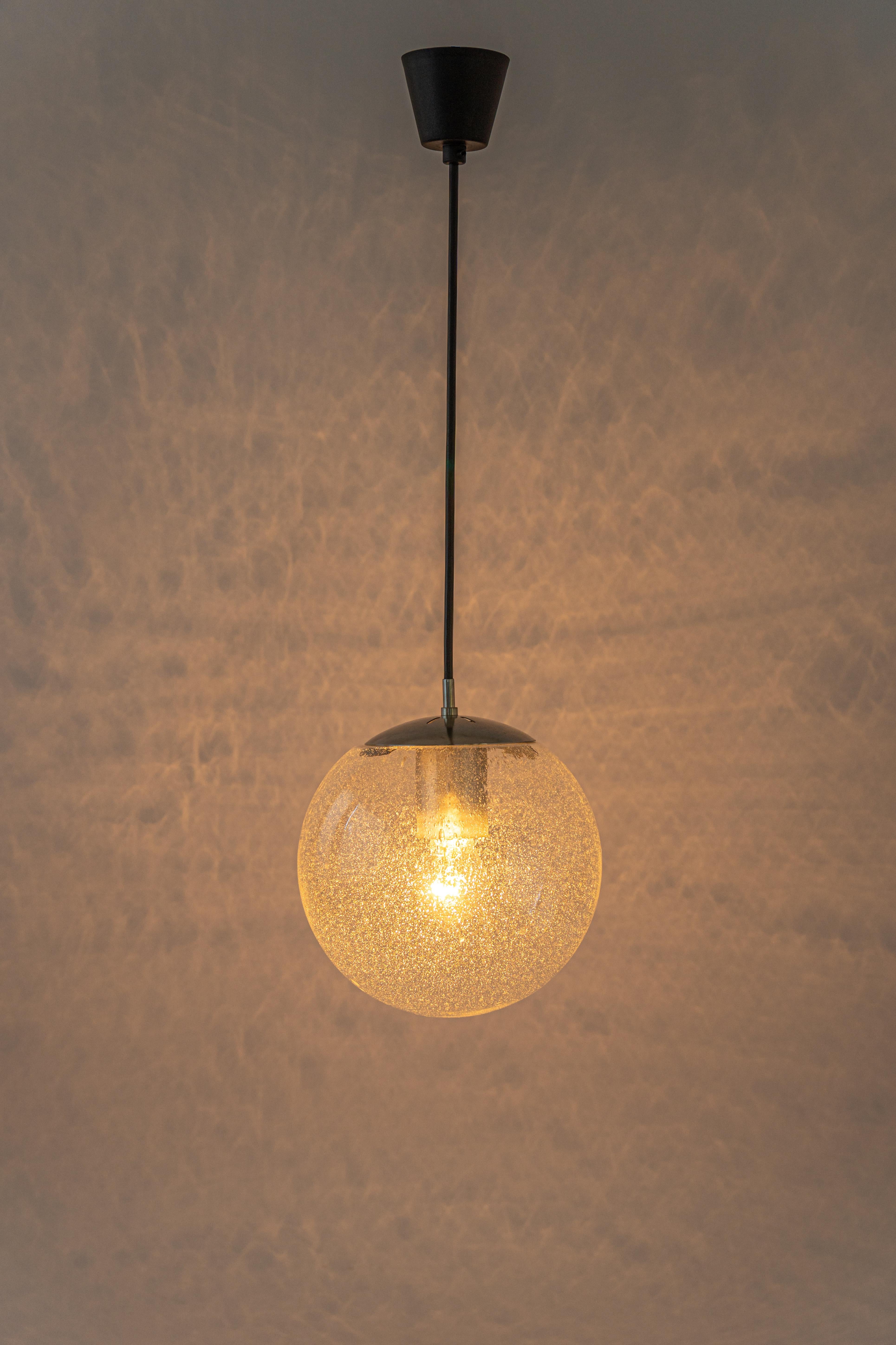 Petite glass ball pendants, manufactured by Limburg, Germany, circa 1970-1979.

Sockets: One x E27 standard bulb 
Light bulbs are not included. It is possible to install this fixture in all countries (US, UK, Europe, Asia, Australia,..)
with