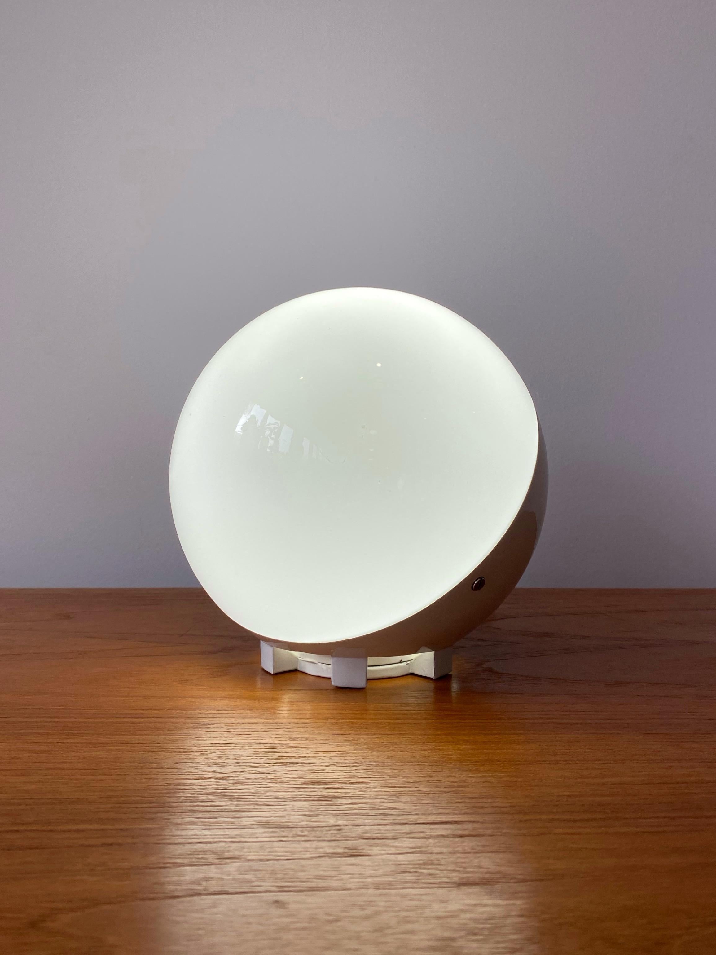 Mid-Century Modern small scale globe lamp. Glass shade sets into white powder coated metal frame. Original “Made in Spain” tags attached.