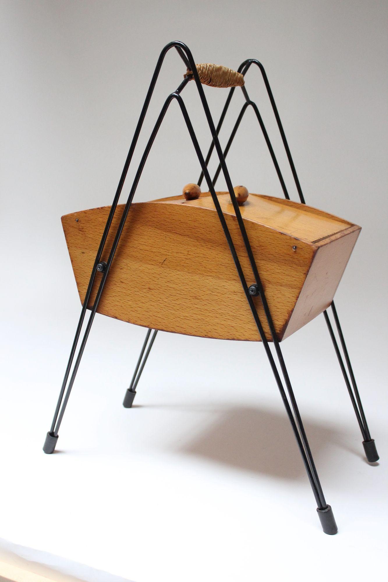 Charming, petite maple sewing box with black painted metal frame and cane-wrapped handle, all supported by rubber feet (ca. 1950s, Italy).
Minimalist design with simple dual-door construction fitted with deeply sculpted oblong pulls.
Conservatively