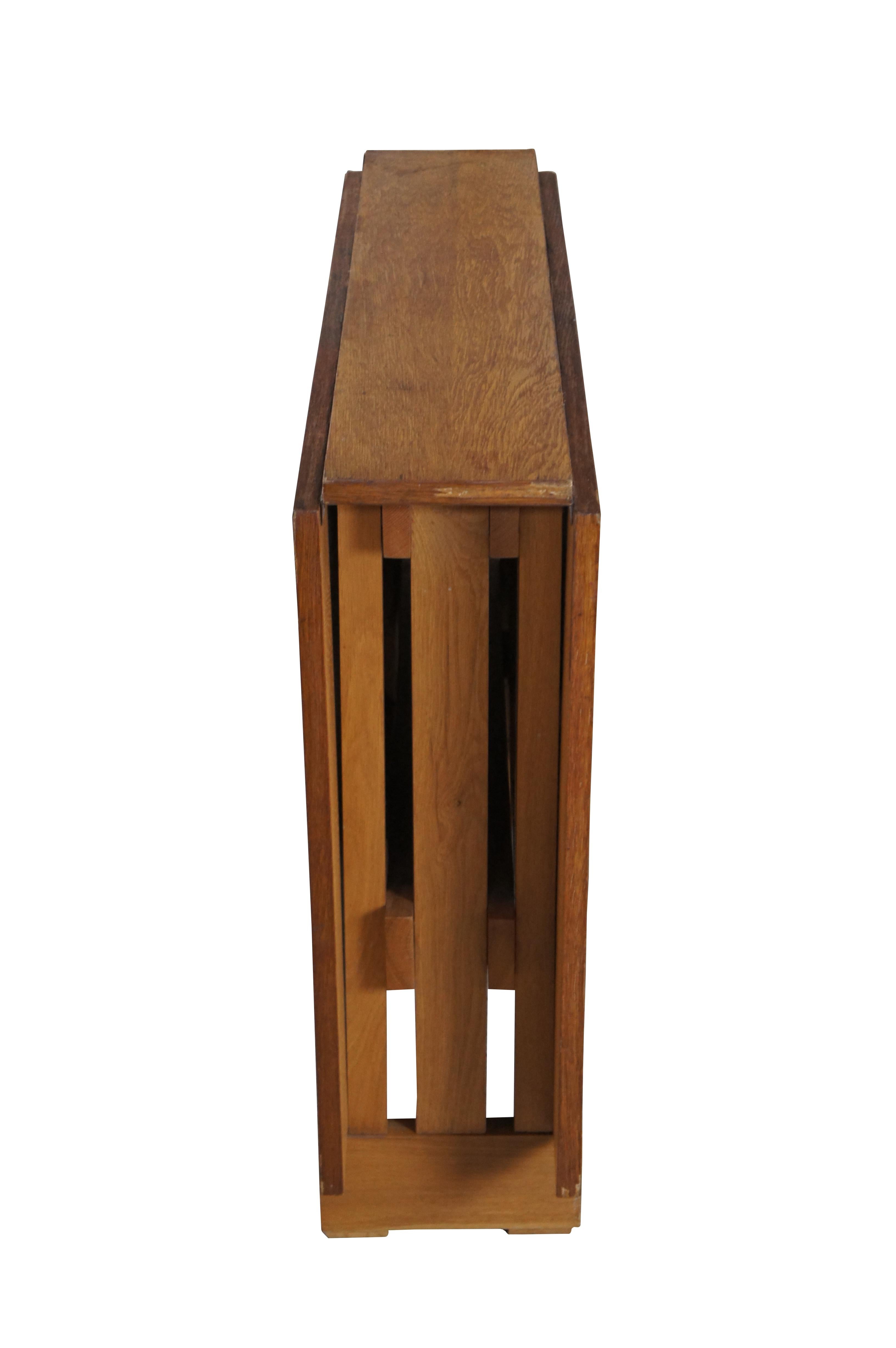 Diminutive Mid Century Mission / Arts & Crafts style Drop Leaf Dining / Console Table.  In the Manner of Bruno Mathsson. Features a petite form made from oak with two long drop leaves supported by Gatelegs.  Sides are slatted.  A minimalist design