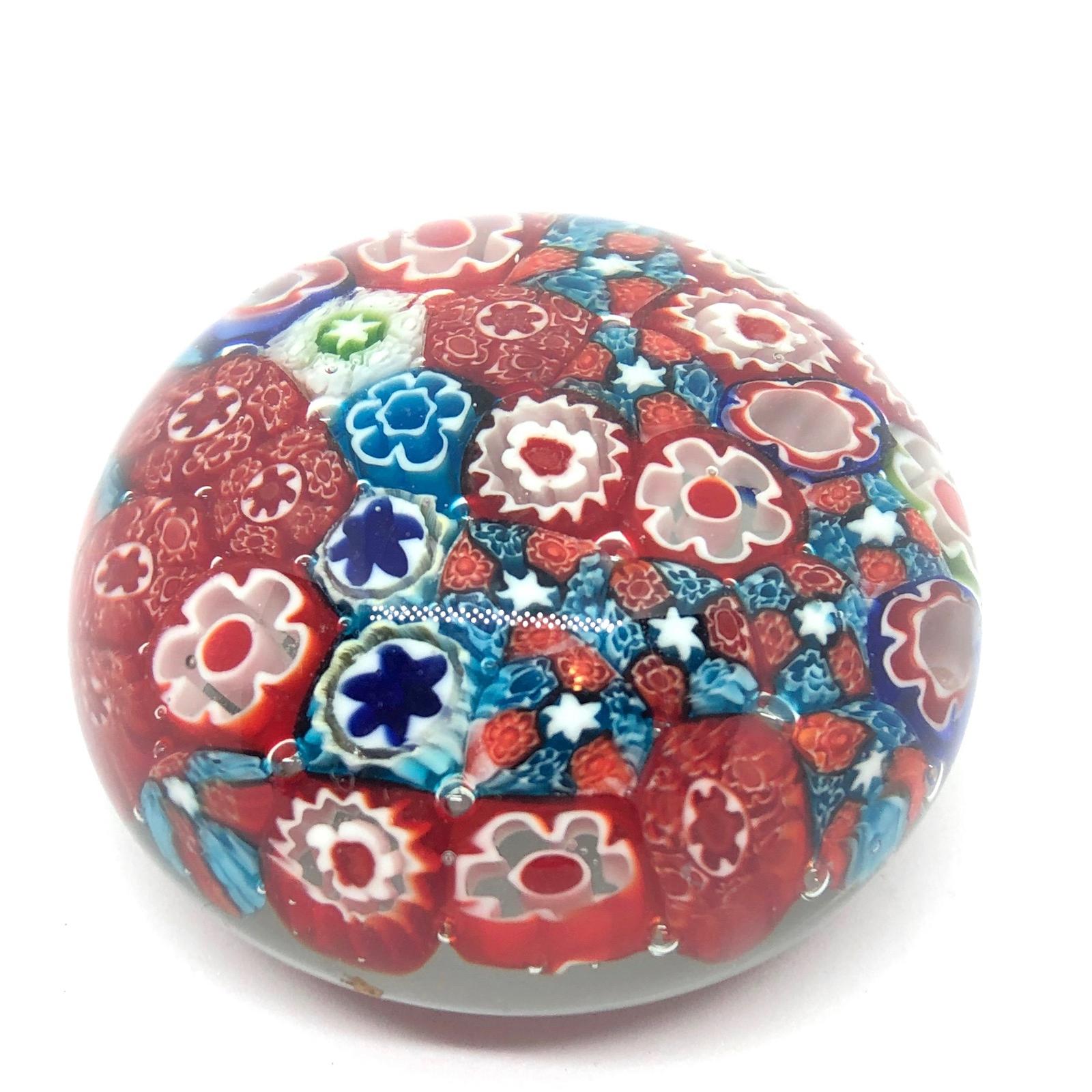 Beautiful Murano hand blown Italian art glass paper weight. Showing some flowers. Colors are a blue, white, green and clear. A beautiful nice addition to your desktop or as a decorative piece in every room.