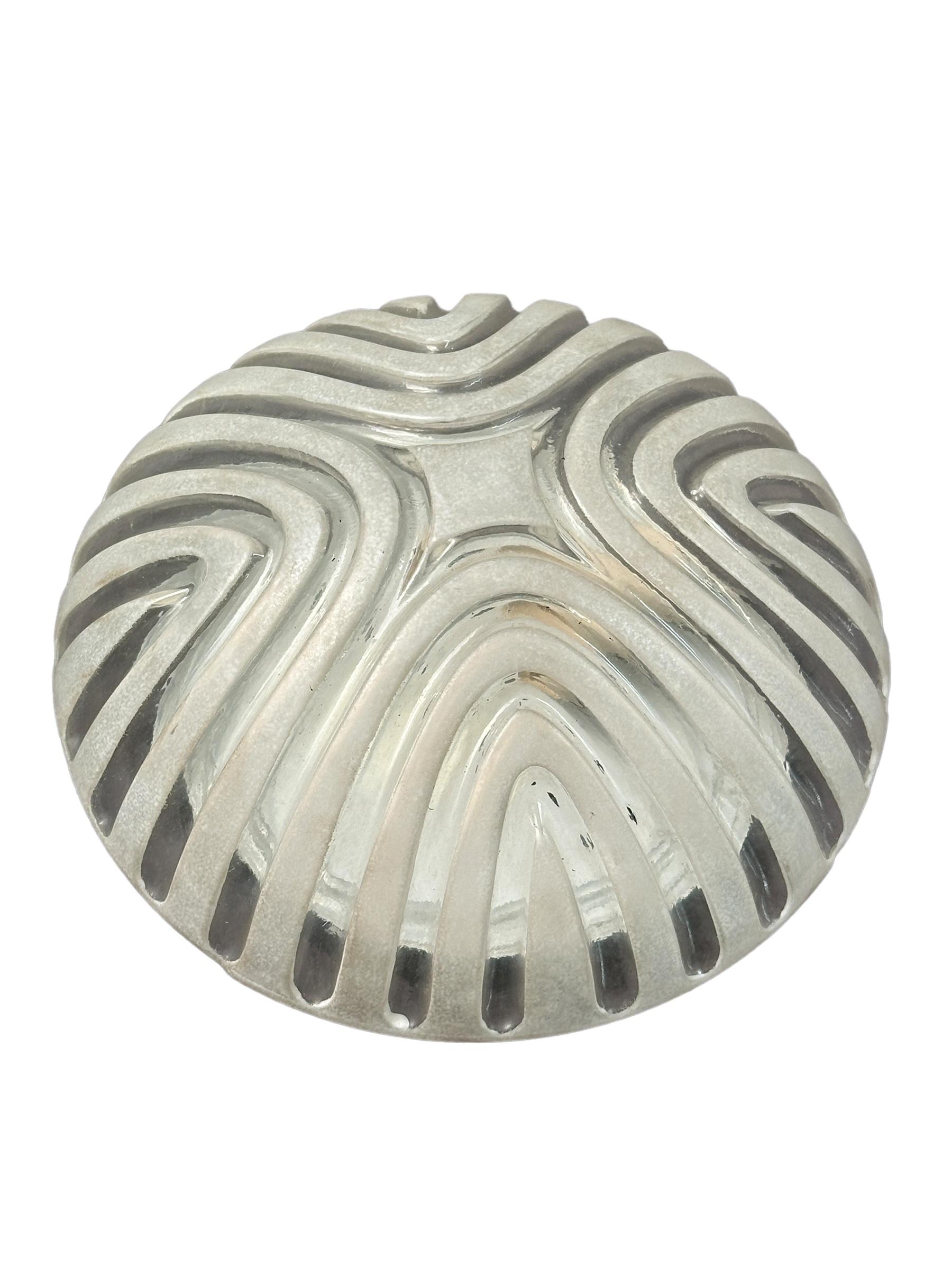 A petite gorgeous futuristic glass flush mount. It can be used also as a wall light. The light fixture requires one European E27 bulb, up to 60 watts. Clear ice glass, mounted on a black lacquered base. A nice addition to any room. Found at an
