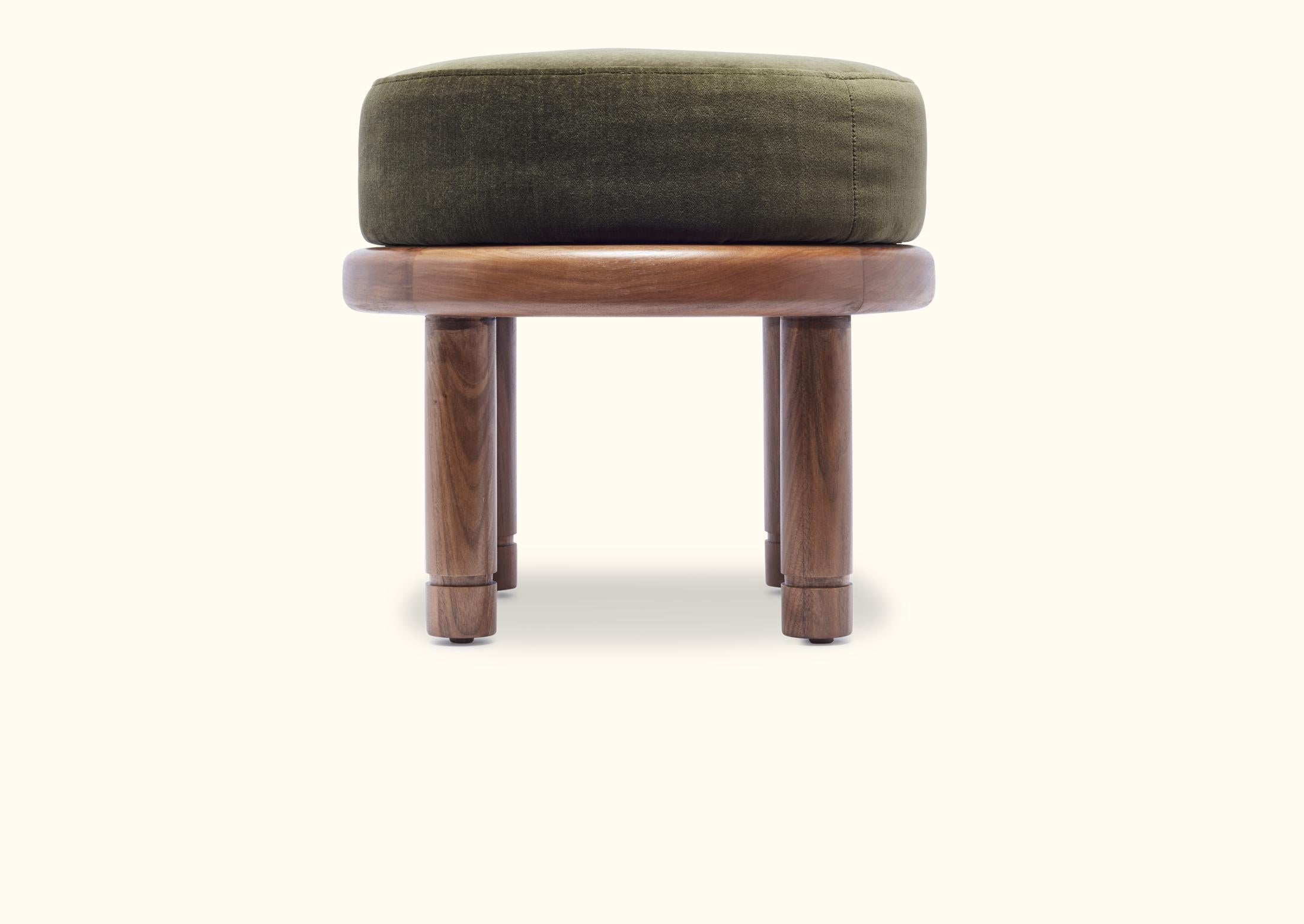 The Petite Moreno Ottoman features a round solid wood base with four cylindrical legs and an upholstered top. Available in American walnut or white oak.

As shown: $1,100
To order: $975 + COM.