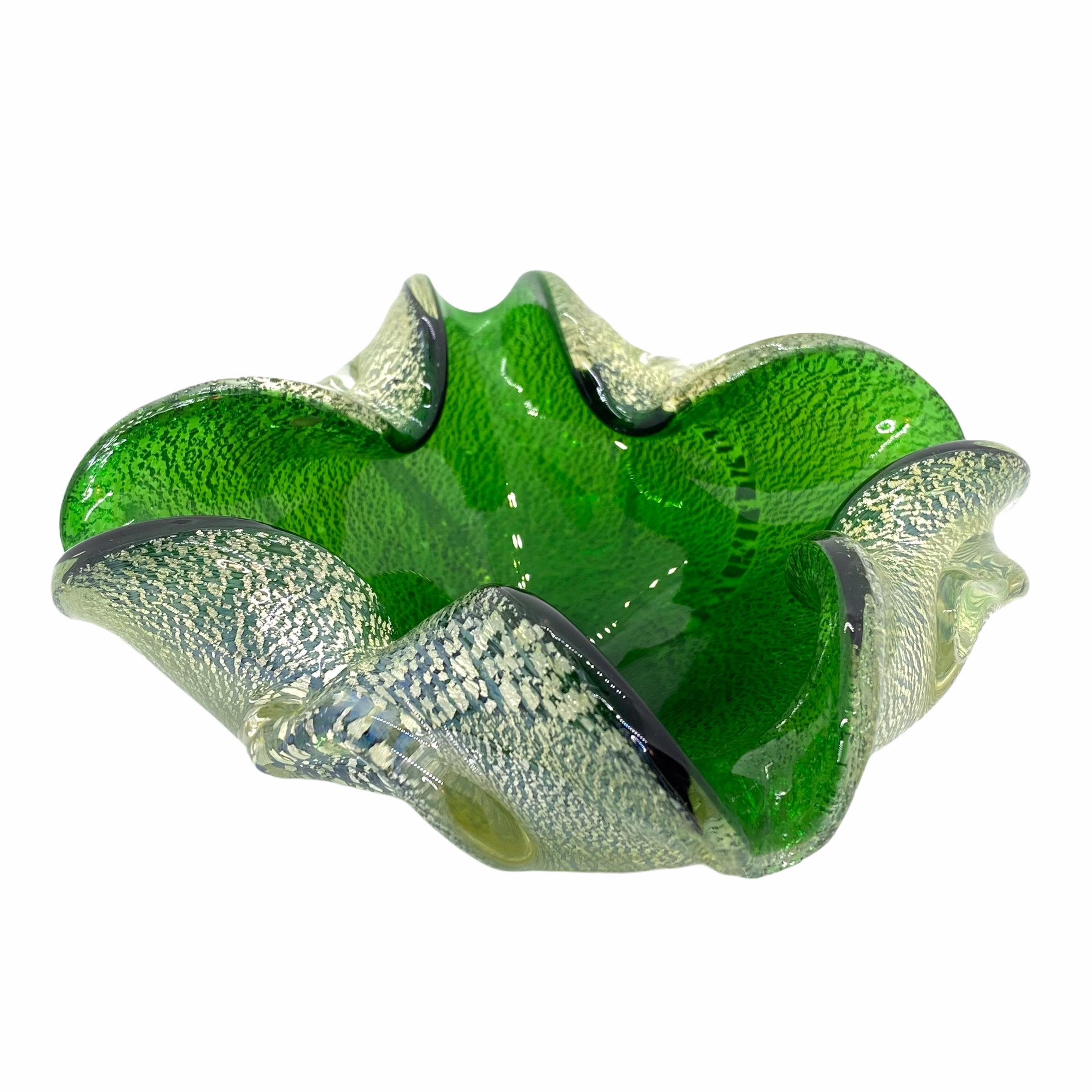 Beautiful Murano hand blown Italian art glass ashtray, bowl or catchall. Attributed to Barovier Toso, a Murano glass company. Made of hand blown green glass, with a clear glass layer and gold flakes on the outside.