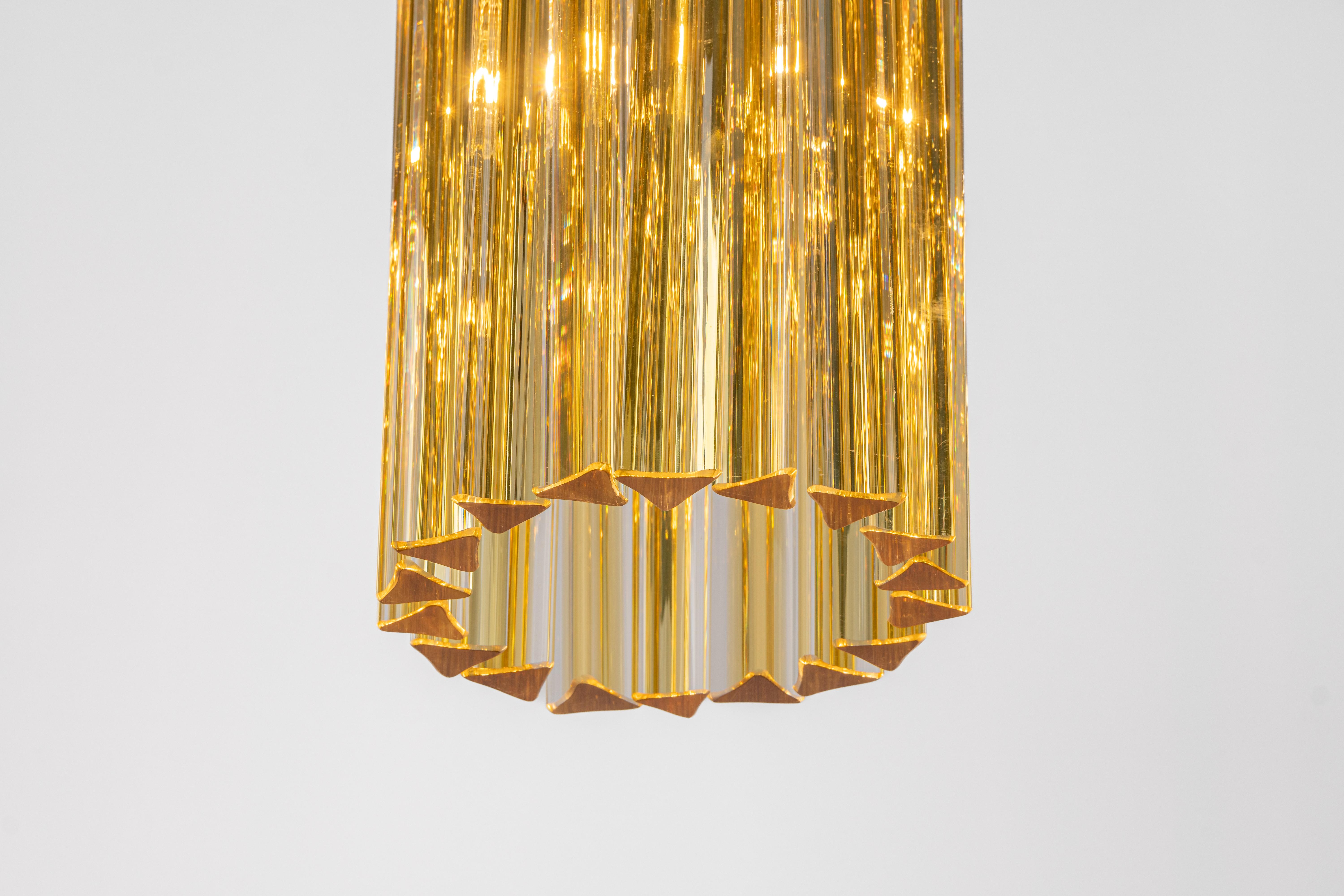 Stunning Murano glass Flush mount light designed by Venini for Kalmar, 1960s
Brass plate gathers 18 structured glasses, beautifully refracting the light very heavy quality.

High quality and in very good condition. Cleaned, well-wired, and ready