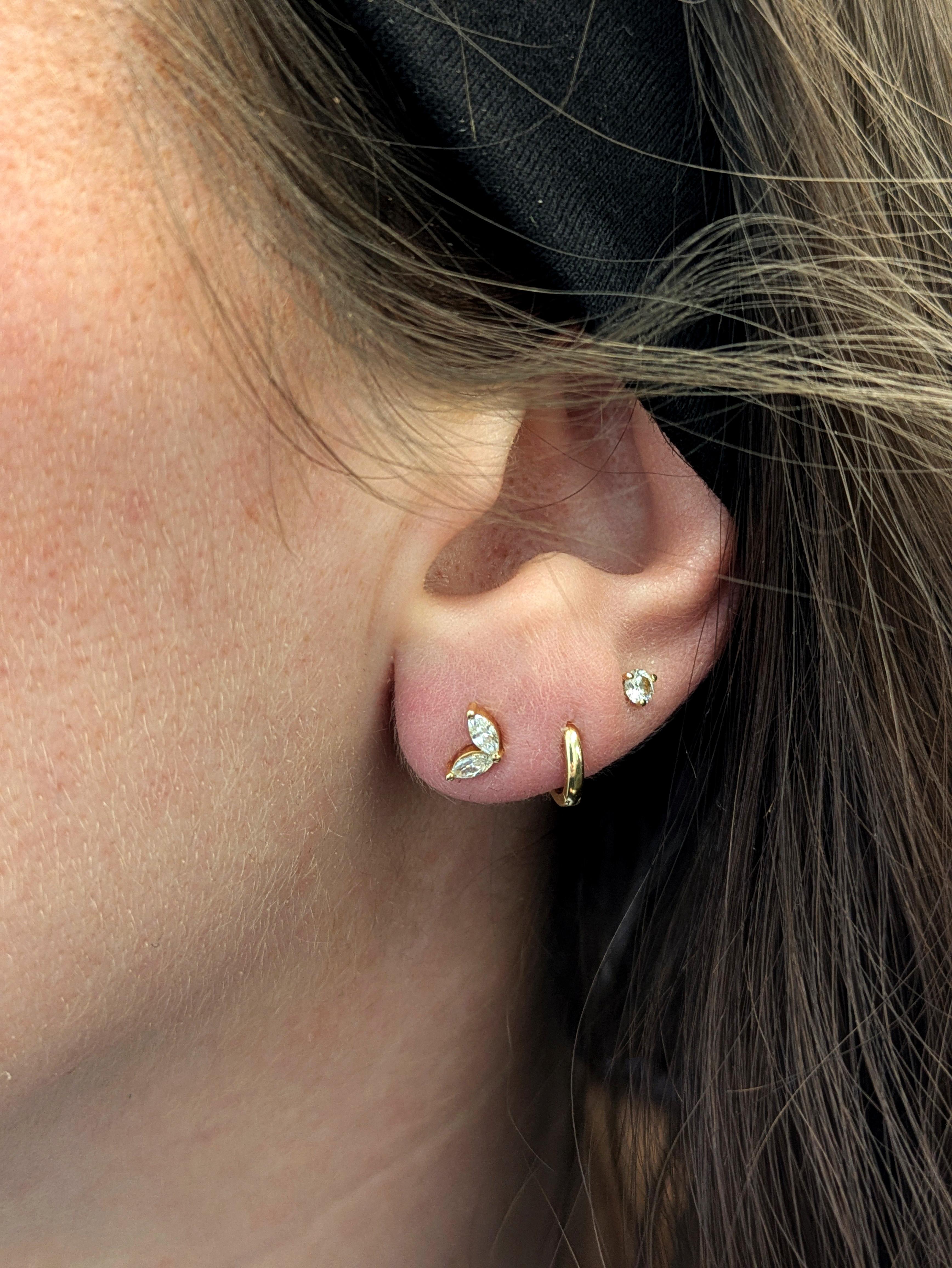 Sweet, sparkly, and full of golden charm—these marquise-shaped two-stone studs in real 14k yellow gold are a perfect pick for everyday elegance. With their dainty size and secure butterfly backings, they make a lovely gift for her, whether it's her
