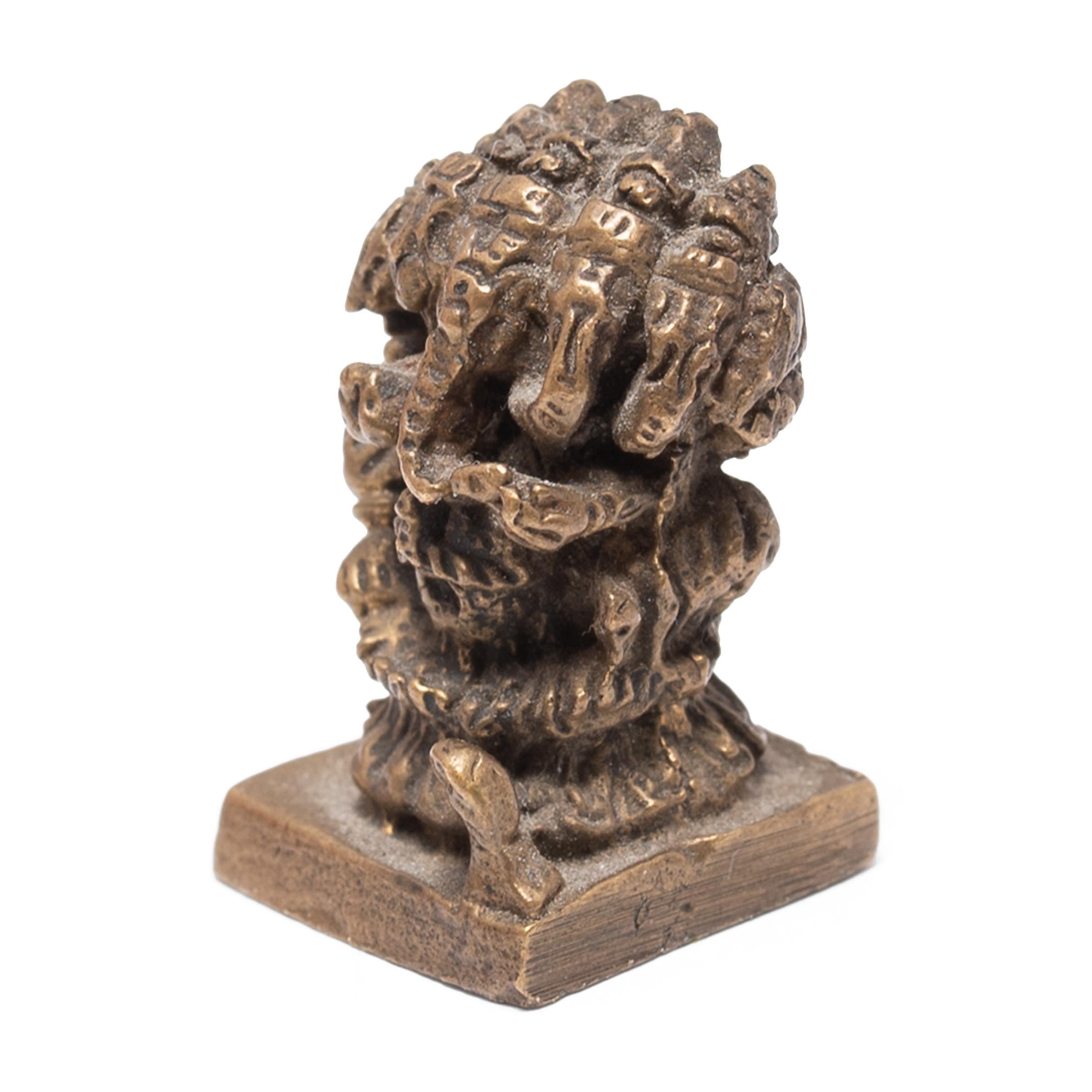 This petite brass prayer figure is cast in the likeness of Heramba Ganapati, the five-headed iconographical form of the Hindu god Ganesha. Invoked at the beginning of prayers, important undertakings, and religious ceremonies, Ganesha is a widely