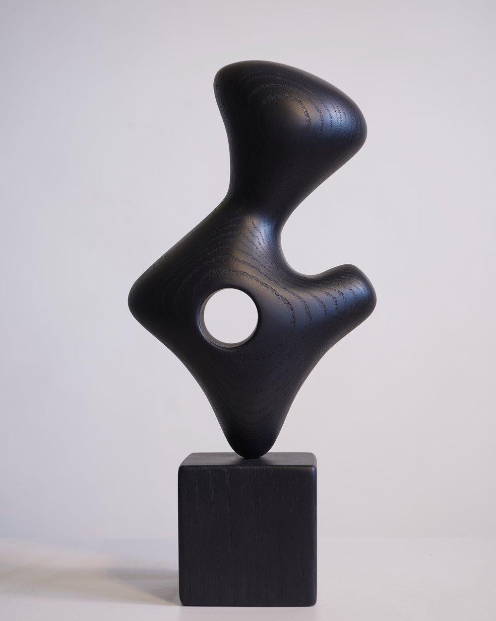 Petite Noire Scuplture by Chandler McLellan
Dimensions: D 7,6 x W 10,2 x H 30,5 cm. 
Materials: Ebonized ash.

Please expect minor differences in wood grain and other naturally occurring details. The sculpture will be signed and dated. Please