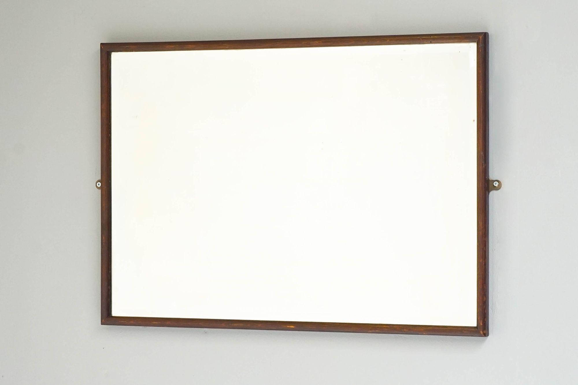Early 20th Century dark oak framed bistro mirror with original foxed glass.

England Circa 1910

H 56cm x W 79cm x D 3cm