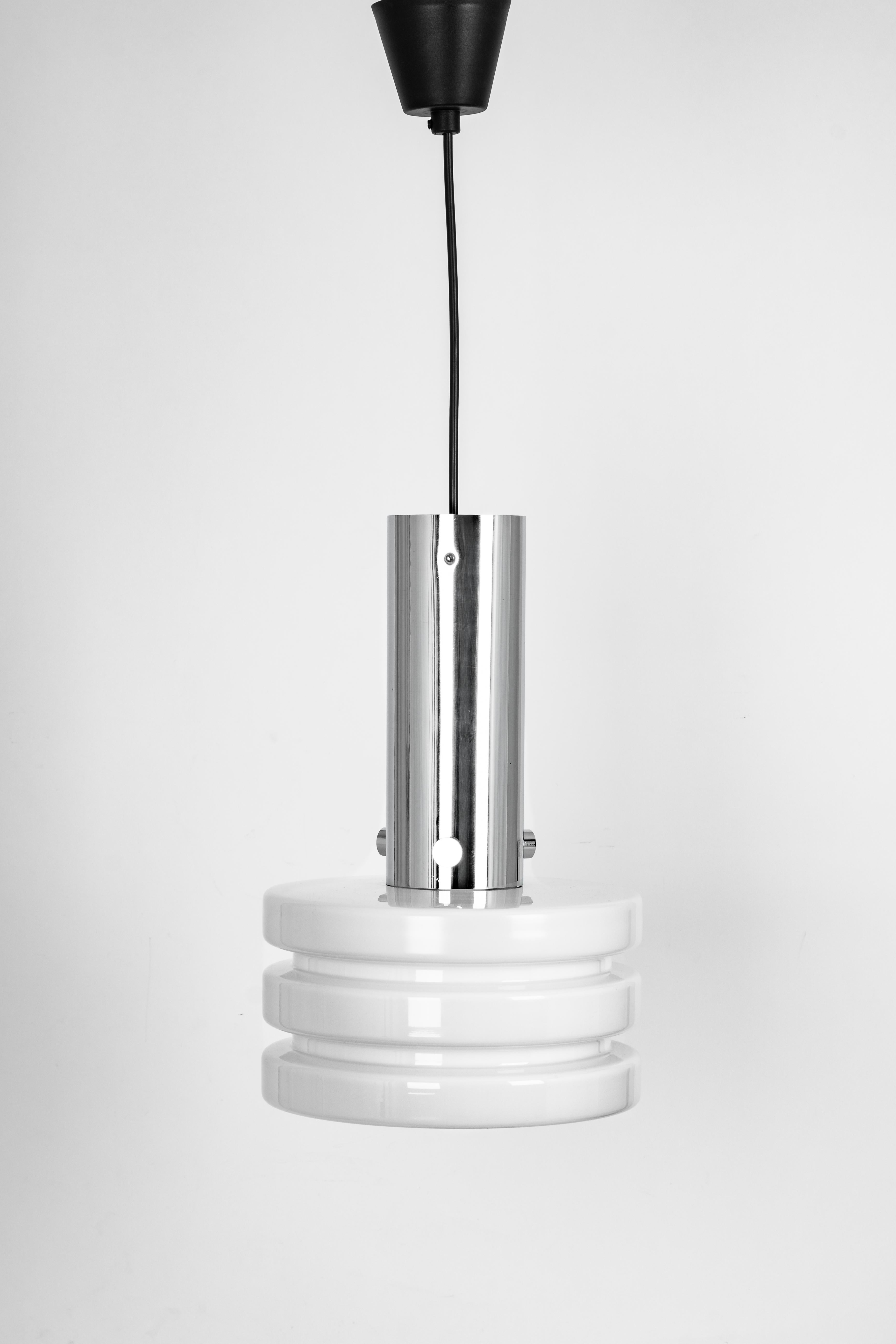 Petite Opal glass pendant light manufactured by Limburg Glashütte, Germany, circa 1960-1969.

High quality and in very good condition. Cleaned, well-wired and ready to use. 

The fixture requires one standard bulb.
Light bulbs are not included. It