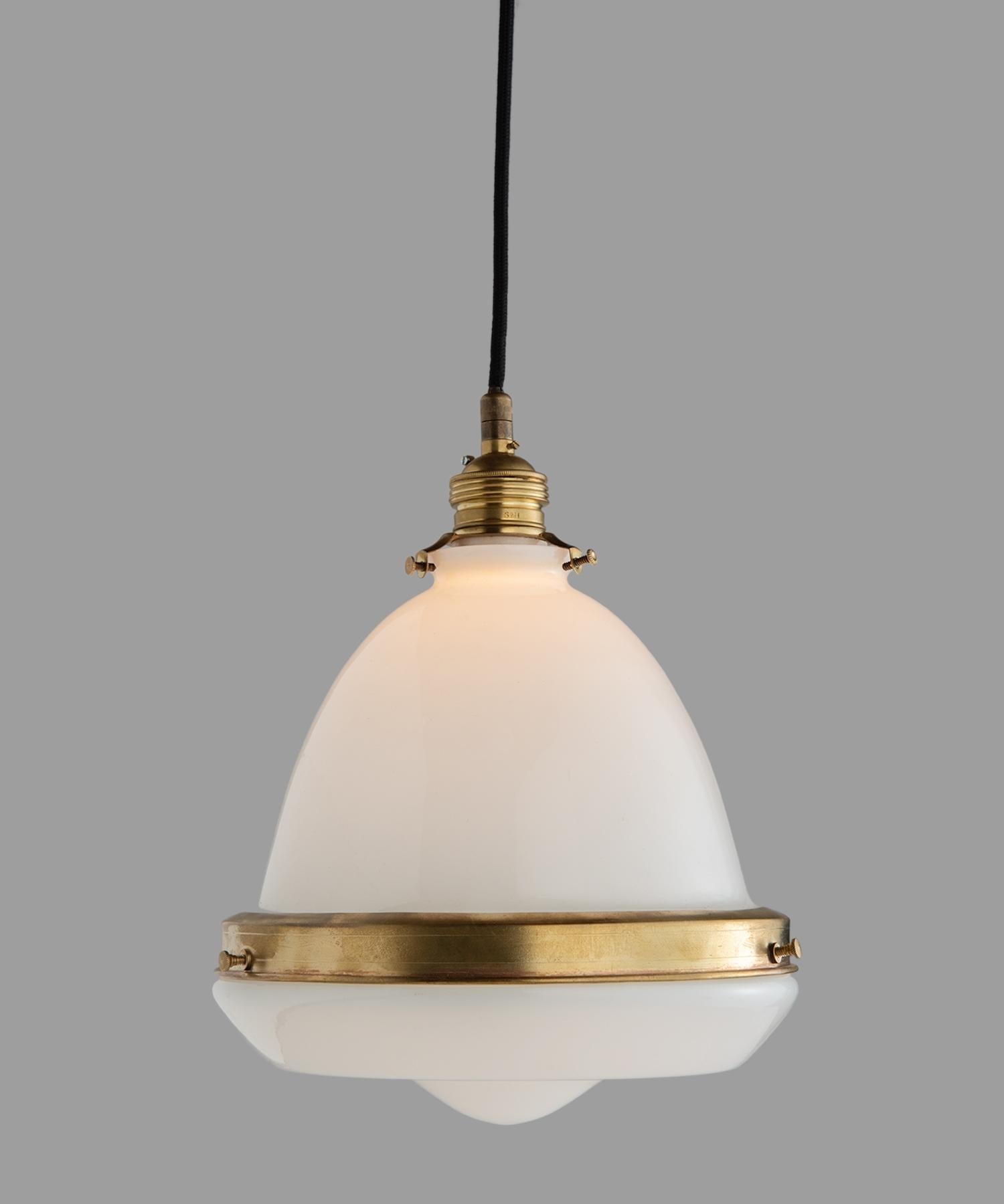 Petite opaline and brass pendant, Italy, 21st century.

Unique form with beautifully patinated brass hardware. Drop is adjustable.

Measures: 8.75