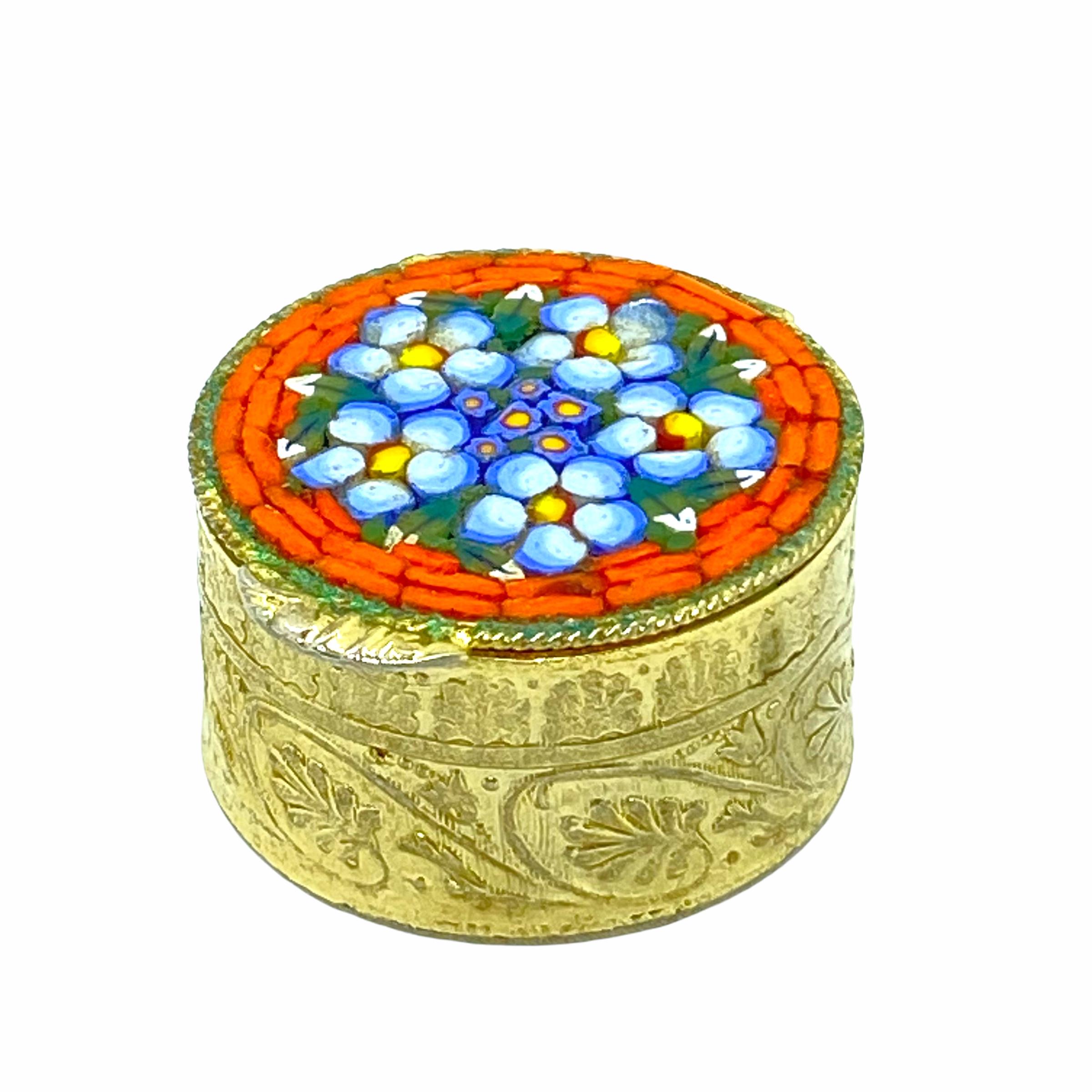 A gorgeous petite micro mosaic pill box. The top featuring micro mosaic made flowers. No restoration has been carried out on this charming little box, which remains in very stabile and functioning condition, wear is consistent with its age and use.