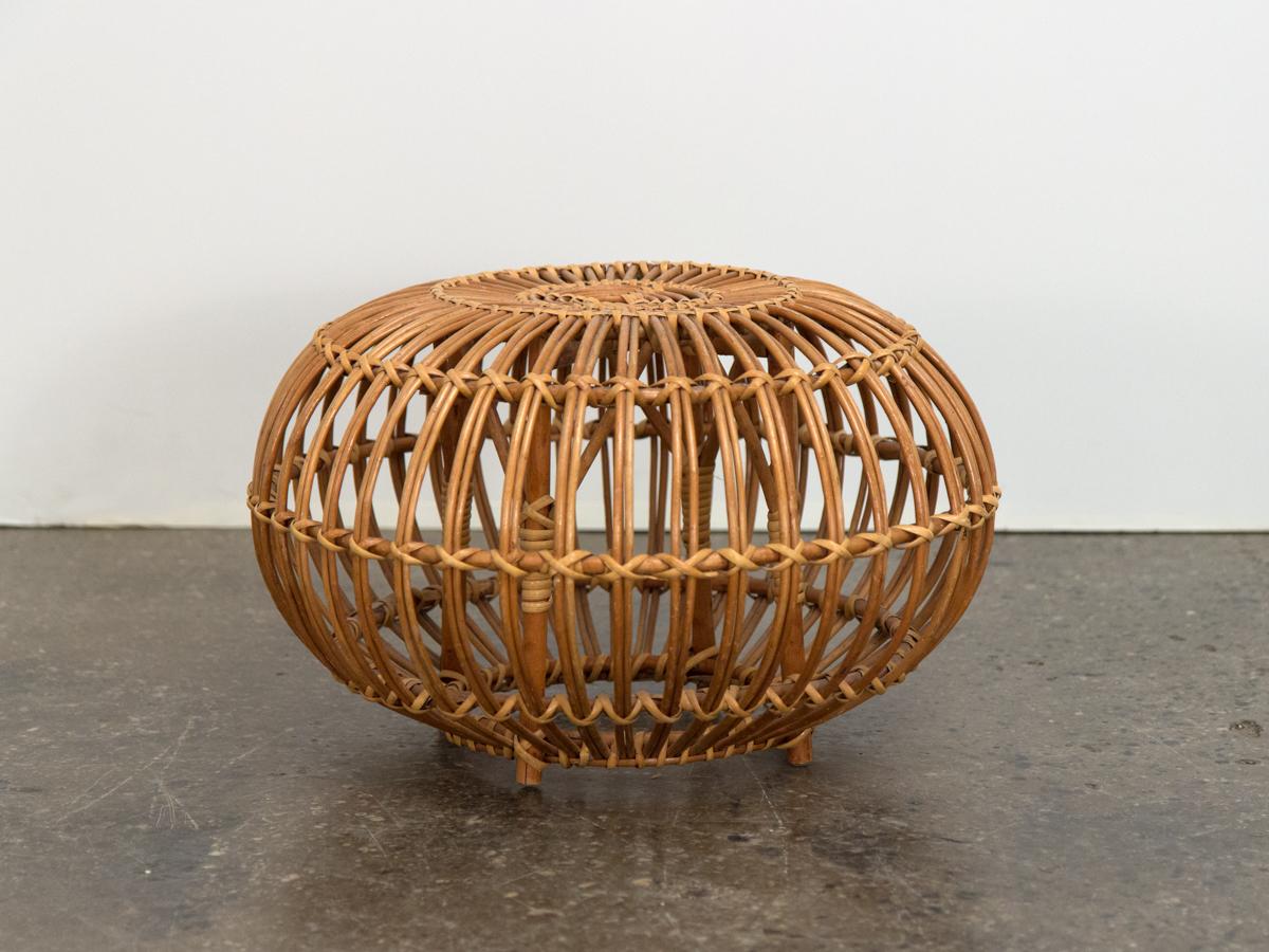 Rare diminutive version of the Classic Franco Albini woven rattan ottoman, designed in 1951. Age-appropriate wear to the woven rattan, but ours is a very nice, clean vintage example. Sound construction woven ties are tightly bound. A stylish,