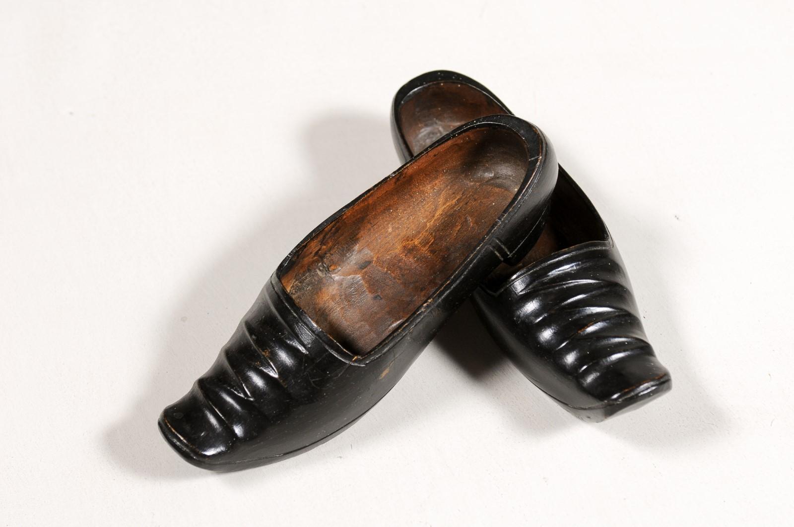 Rustic Petite Pair of Dutch 19th Century Ladies' Carved Wooden Clogs with Black Paint For Sale