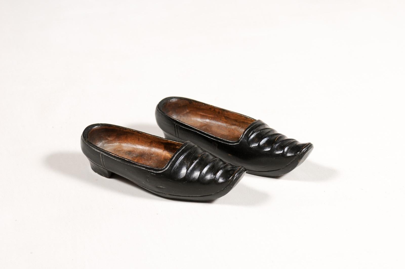 Hand-Carved Petite Pair of Dutch 19th Century Ladies' Carved Wooden Clogs with Black Paint For Sale