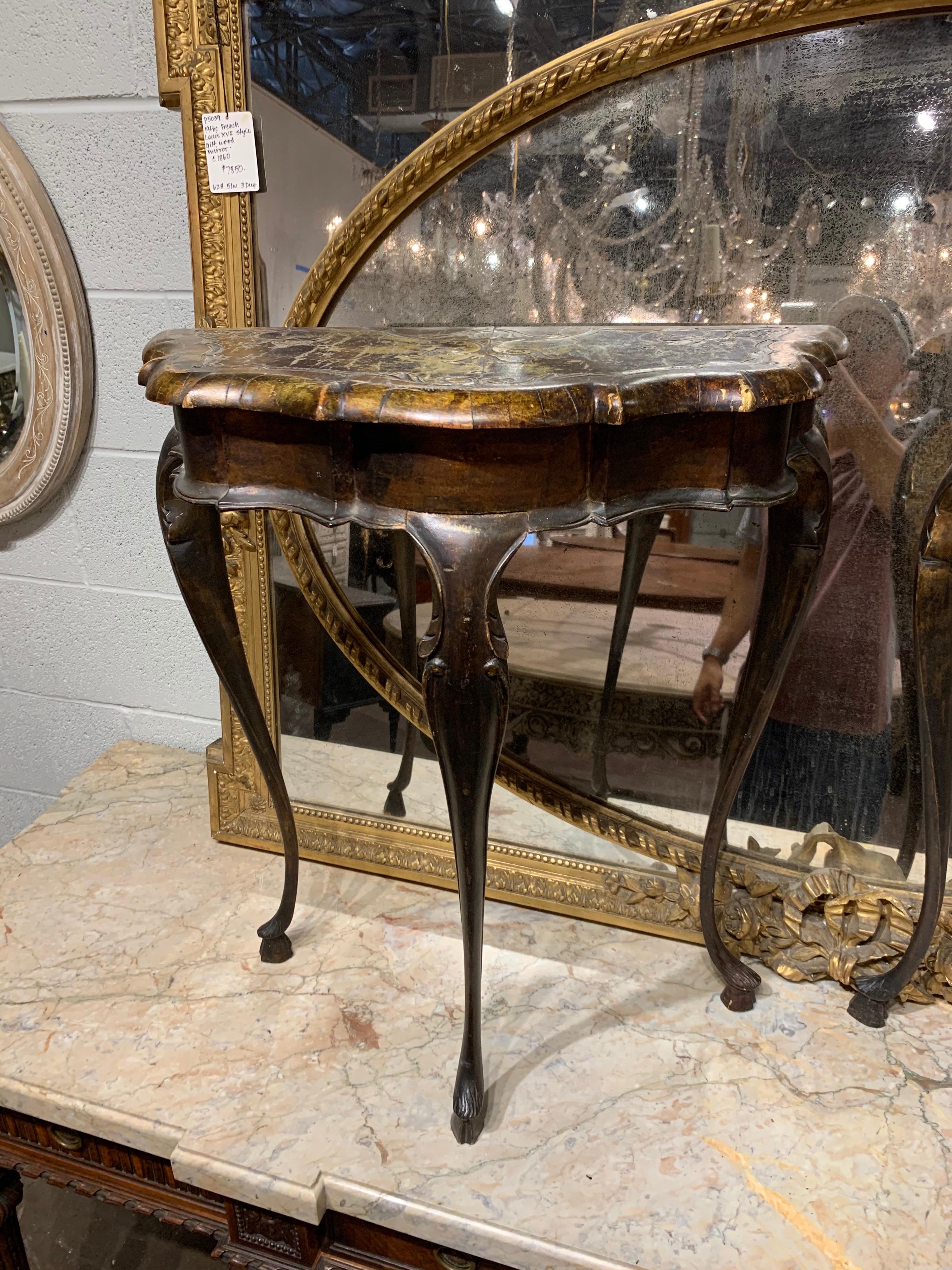 Fine pair of petite Italian shaped consoles. These have a painted design on top that has aged over the years. Handsome accent tables!
