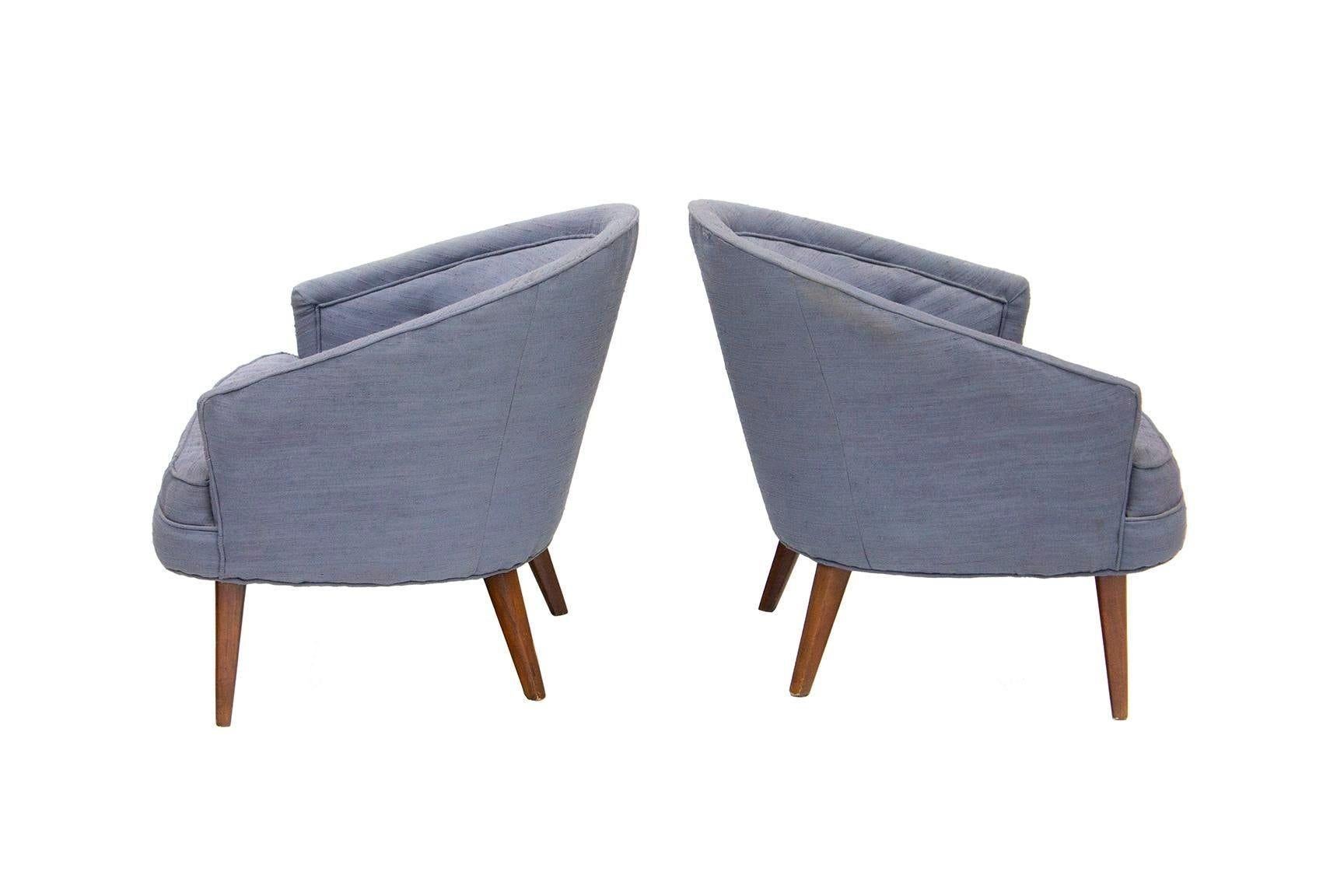 USA, 1960s
Pair of tufted midcentury armchairs in slate blue upholstery with walnut legs. These chairs are a more petite scale. Personality-filled.
DIMENSIONS: 30