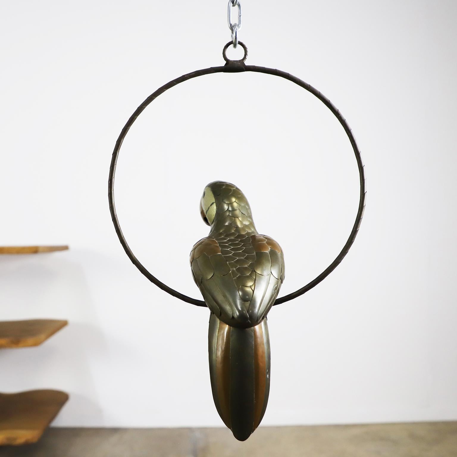 Copper, brass and aluminium Parrot on a hoop hanging stand attributed to Sergio Bustamante, circa 1960, Great vintage conditions.
