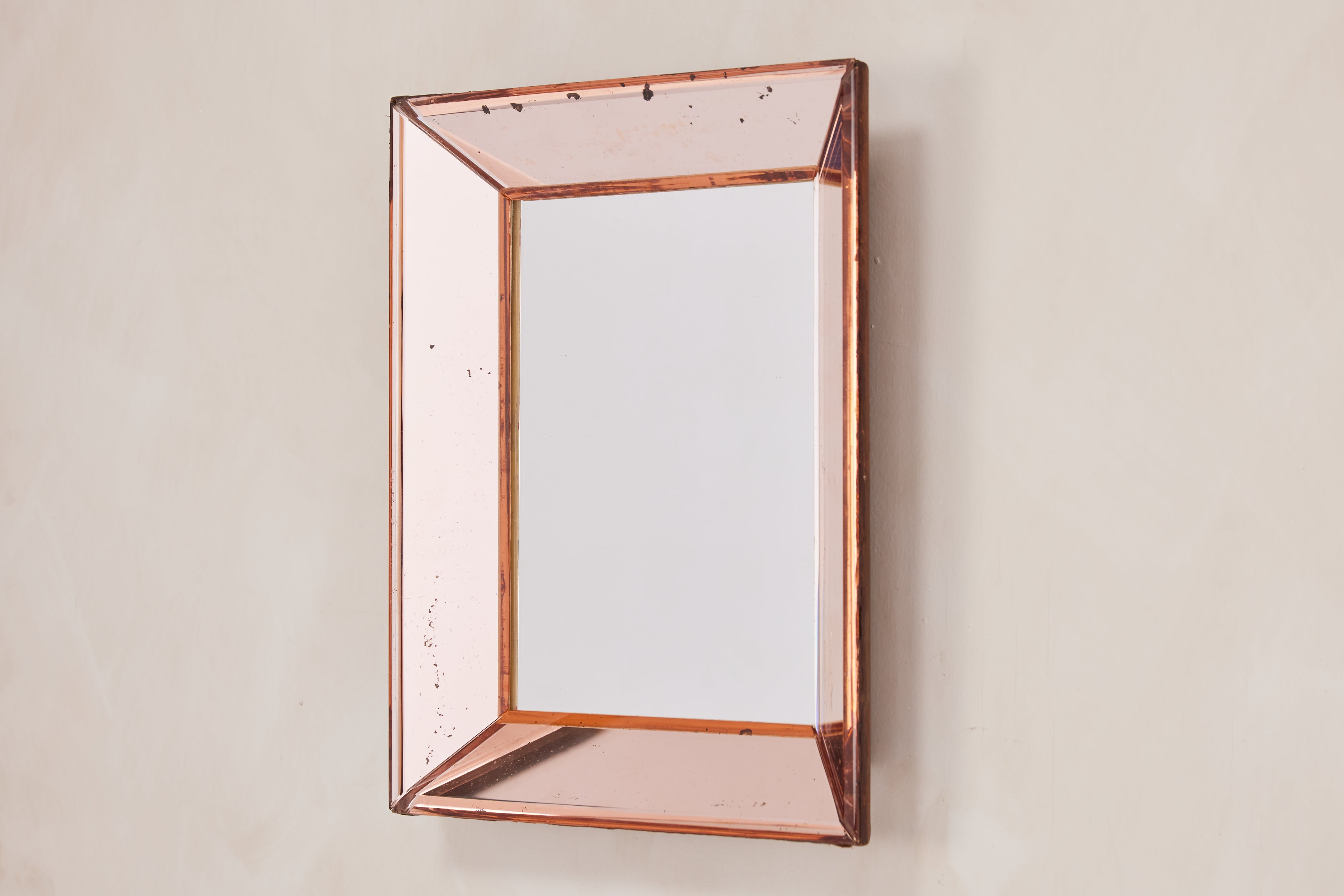 Petite in scale and wonderful in charm! 

Peach glass Cristal Arte mirror with great patina and scale 

Perfect for powder room or hallway 

Italy, 1950s