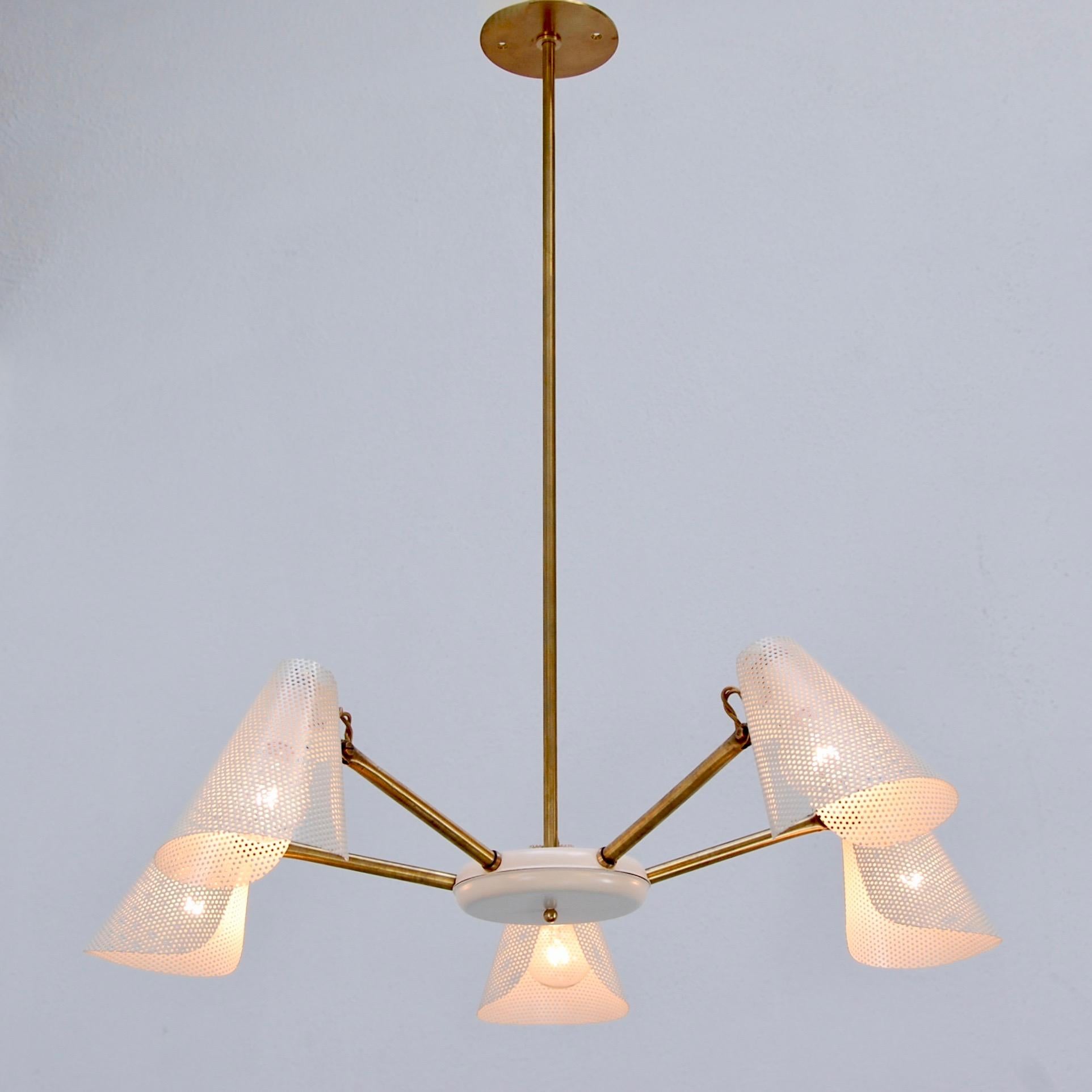 Classic midcentury (5) light perforated shade and brass chandelier from 1950s France. Aged brass patina. Wired for use in the US. Current OAD can be adjusted upon request. (5) Single E12 candelabra based light sockets. Light bulbs