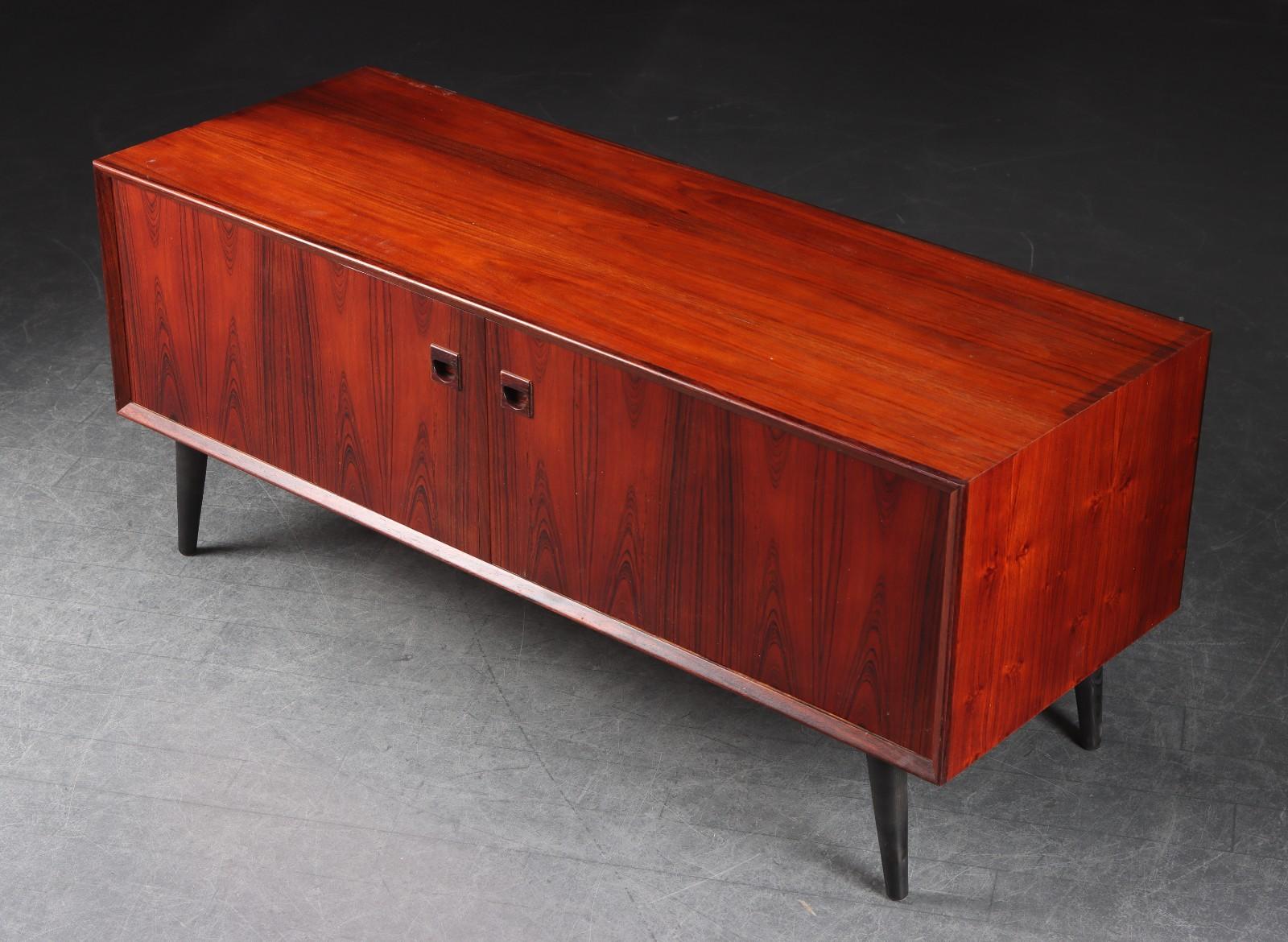 Petite and beautiful rosewood sideboard from Denmark, Designed by Erik Brouer and manufactured by Brouer. Very good vintage condition without any damages or veneer losses. Comes with Cites certificate. Can only be sold wihin Europe due to Cites