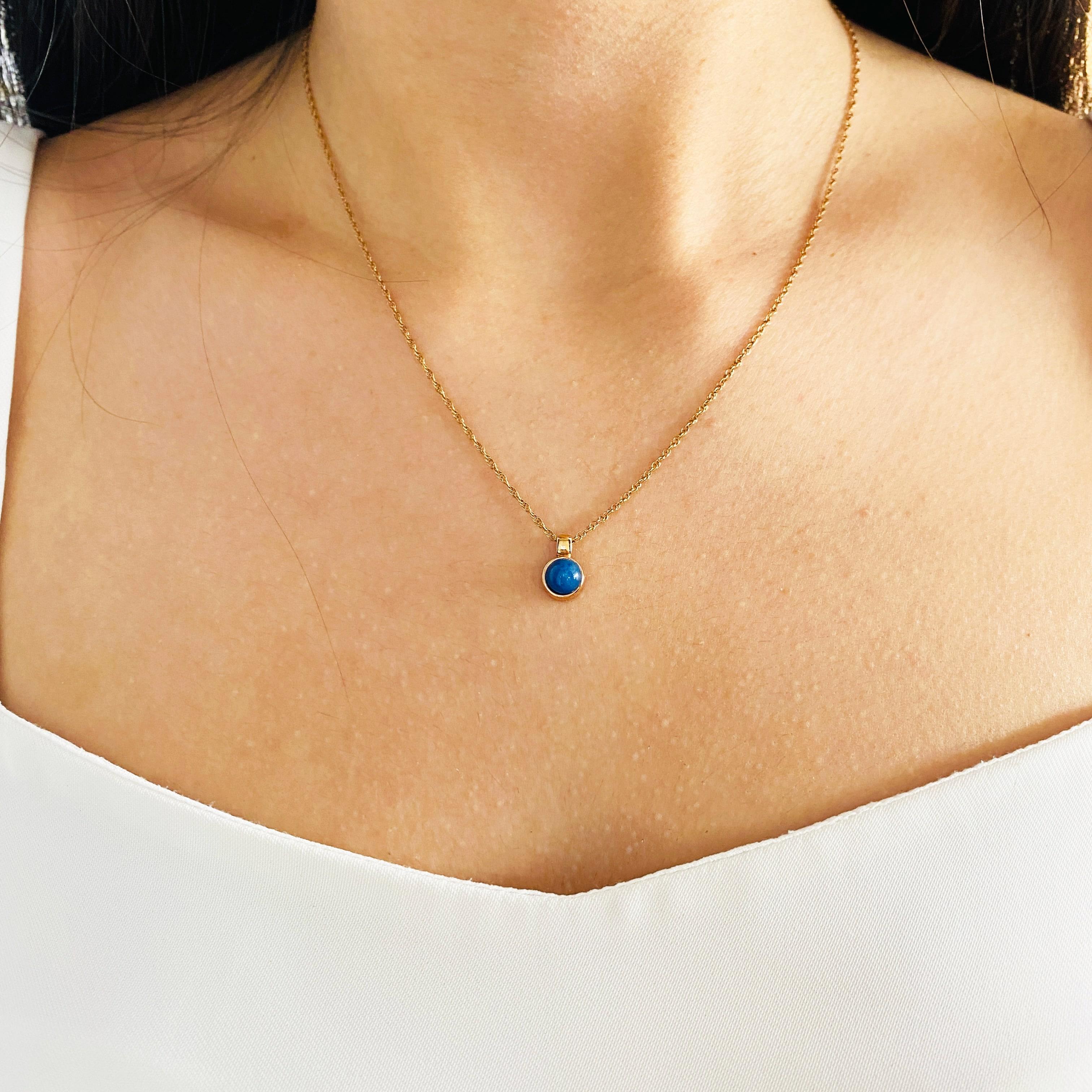 This beautiful petite pendant has a rich blue lapis lazuli dome set in rose gold! There is a wonderful pattern of sparkles amidst the deep blues of the stone that our photos can't quite capture! The rich texture of this lovely little beauty is