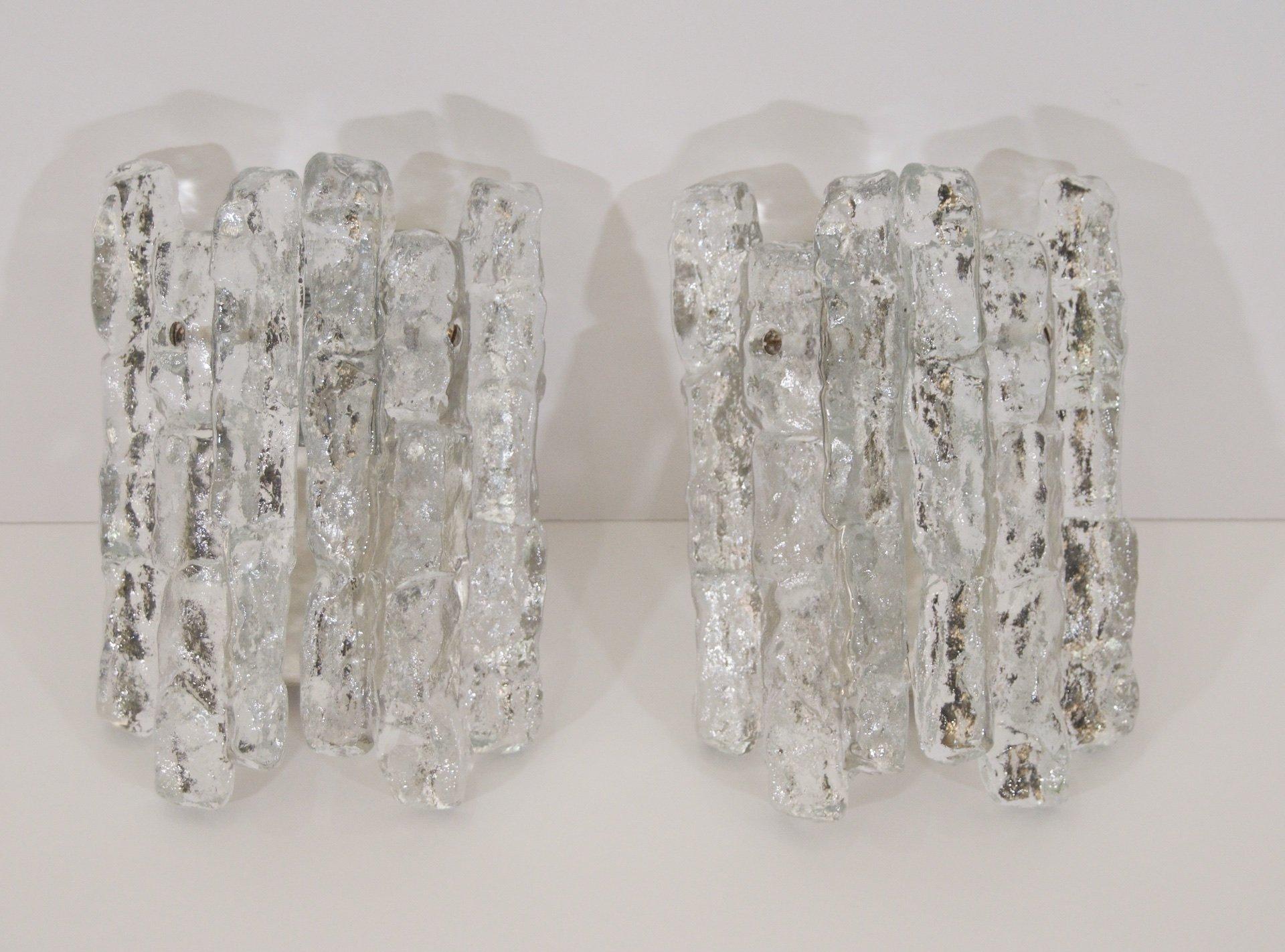 Kalmar Franken KG
Austria, 1960s

Excellent Kalmar ice glass wall sconces, each having two heavy pieces of ice glass. Petite size will work wonderfully in many spaces, ideal for narrow spaces.

One E-14 base bulb per sconce up to 40 watts, new