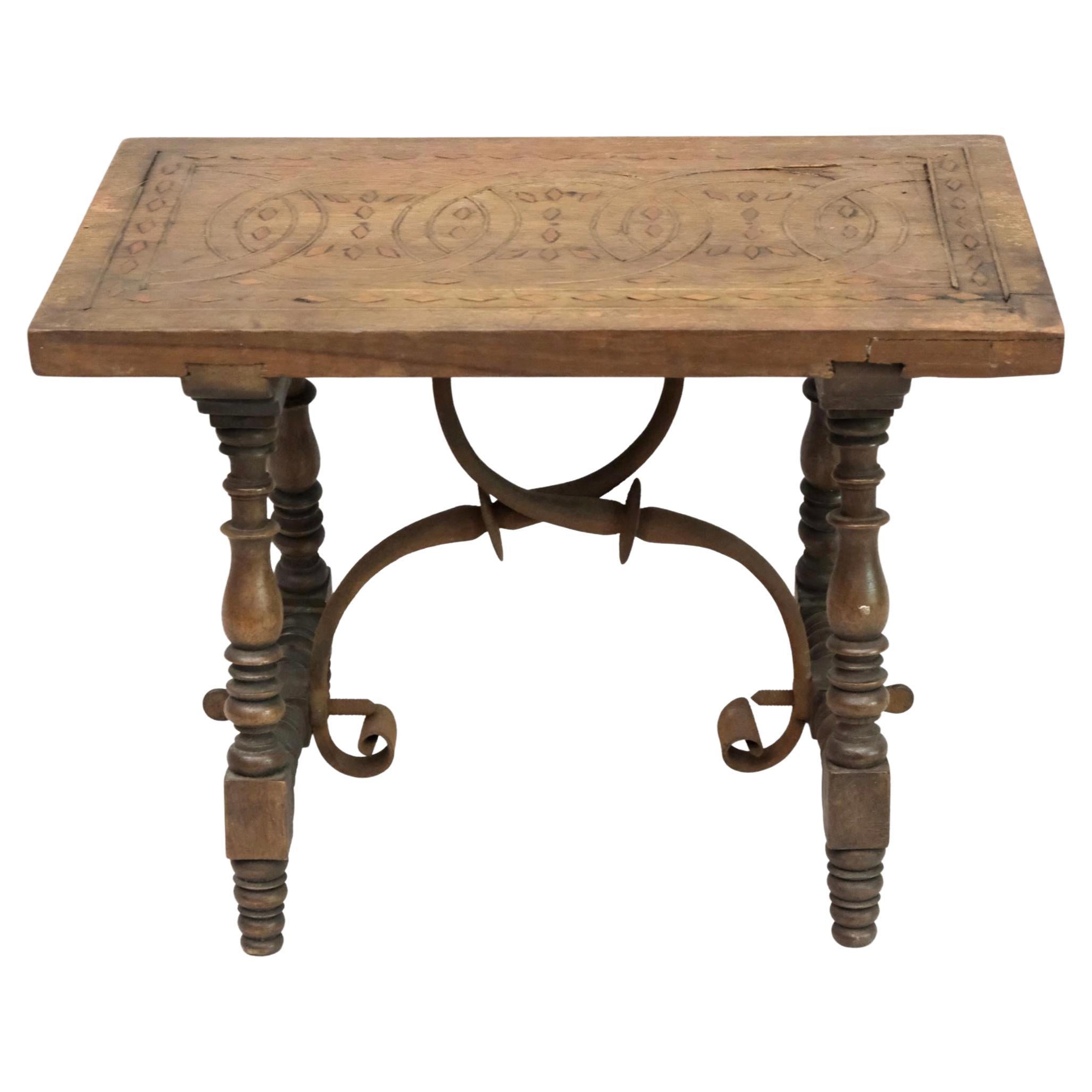 A unique Gothic style small stool with decorative carved wood top, elaborately turned legs and hand forged metal support 7