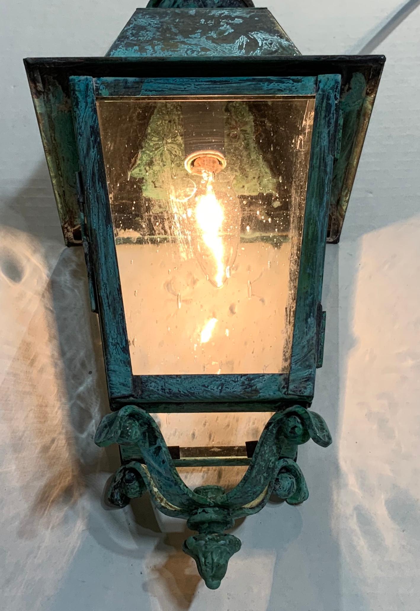 Beautiful Verdigris small hanging lantern made of solid brass with seeded glass four sides,
One 60/watt light, suitable for wet location, canopy included.