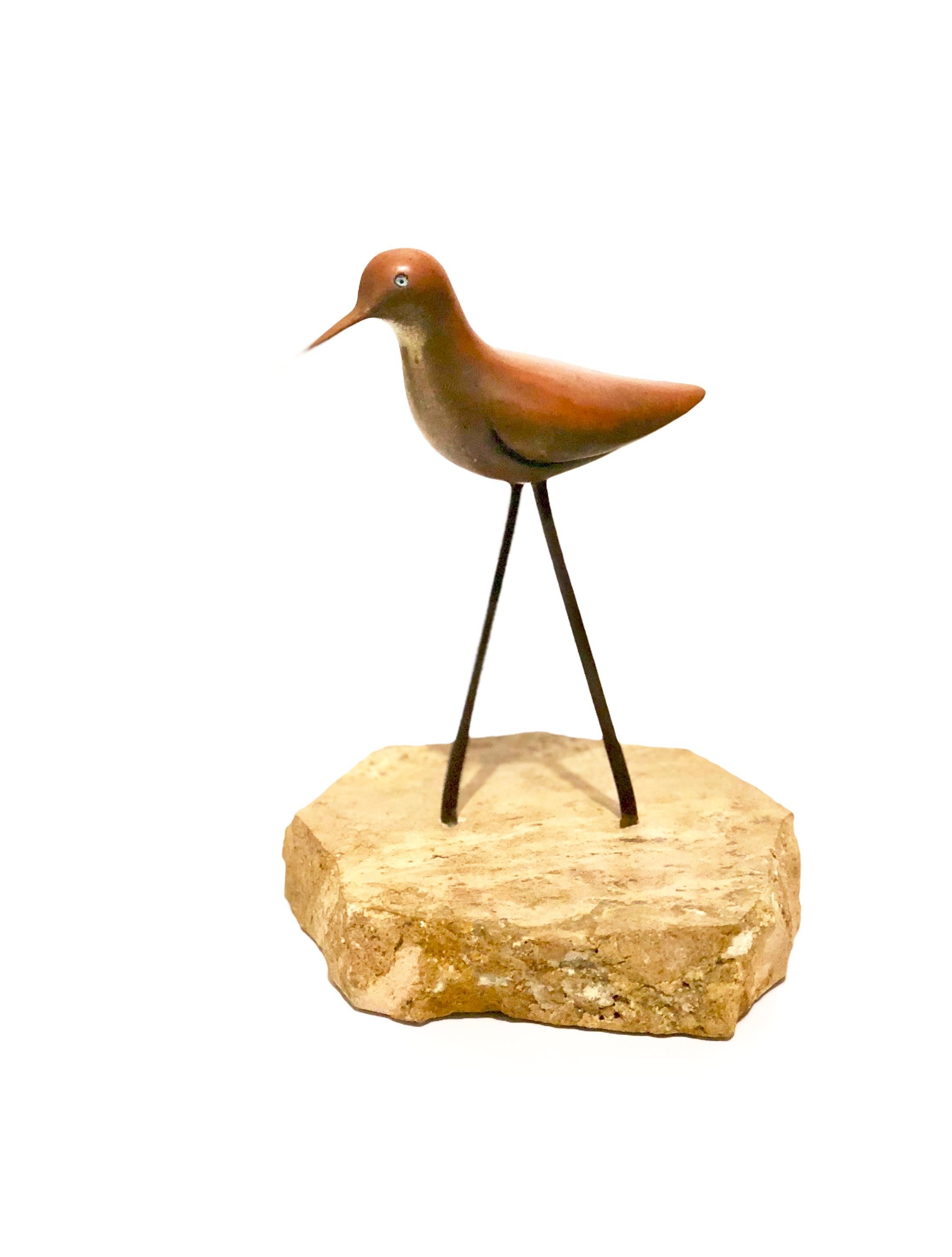 A delicate solid brass small sculpture of a bird sitting on solid marble base, circa 1970s we believe its made by Studio Jere. Great patina that can be polished if wanted.