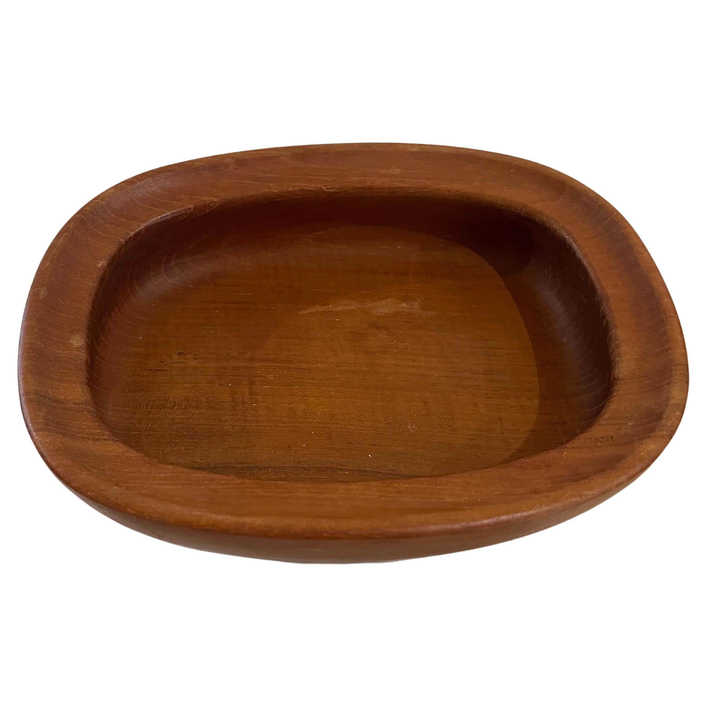 Beautiful solid teak Danish modern bowl . catch it all made by Nissen circa 1970's beautiful condition.