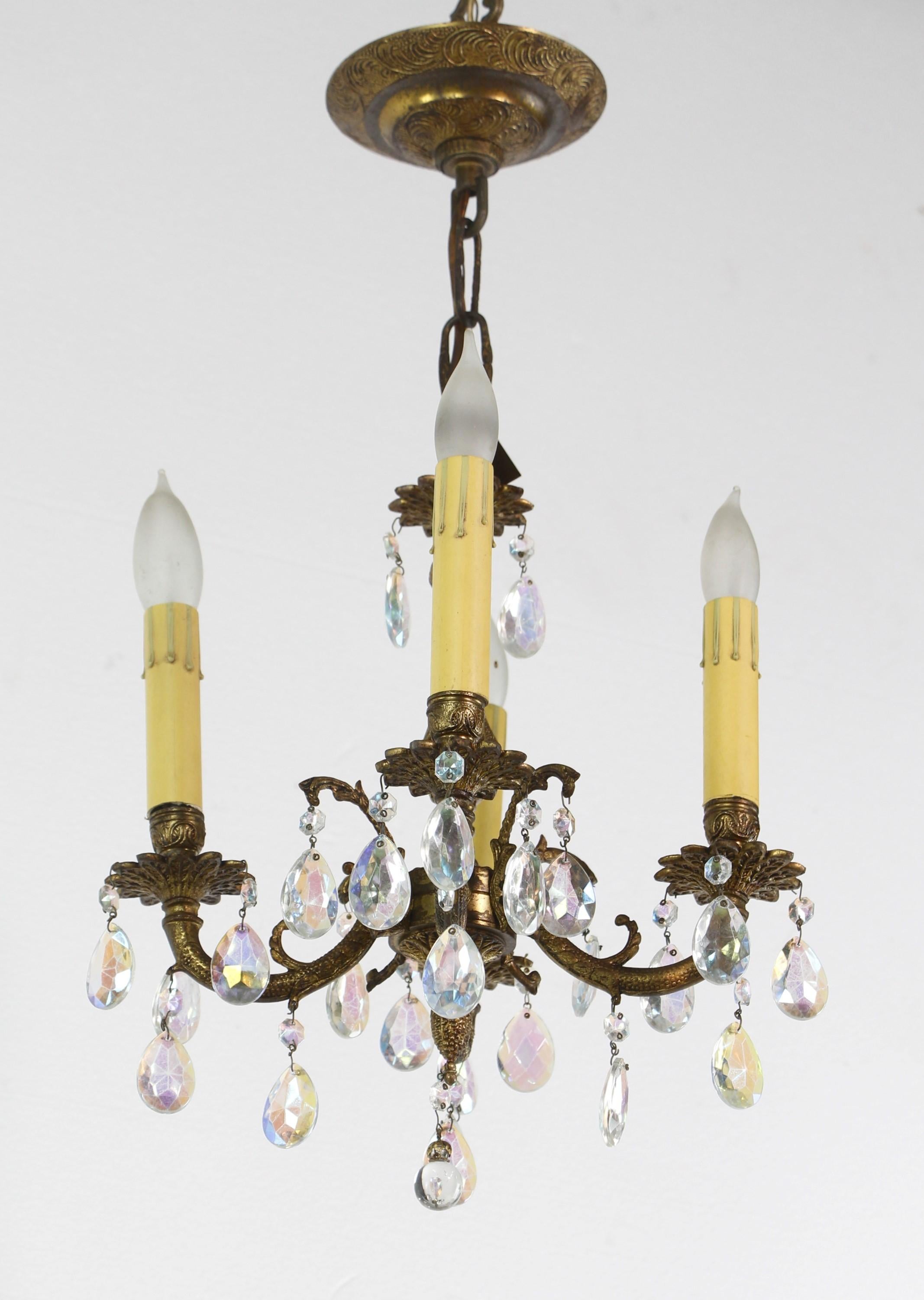 Cast bronze chandelier made in Spain adorned with iridescent crystals. Cleaned and restored. Please note, this item is located in our Scranton, PA location.