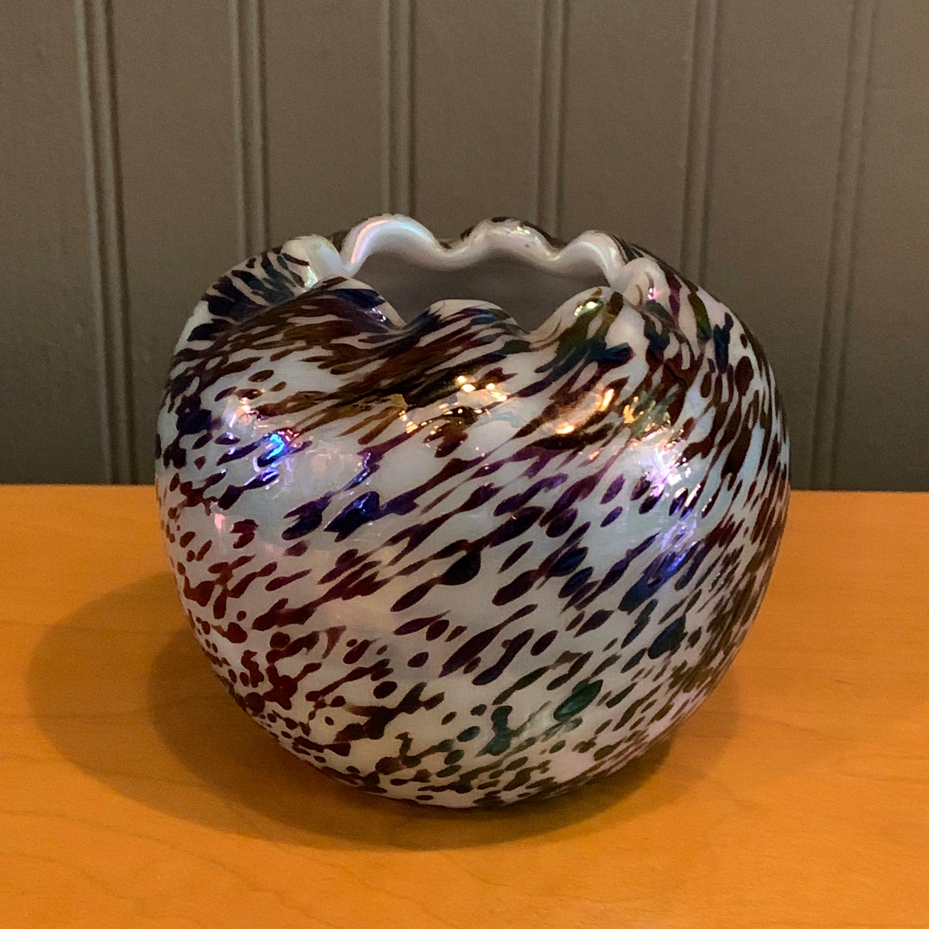 Lovely, little, midcentury, hand blown glass vase features a speckled treatment with iridescent finish and pie crust ruffle opening.