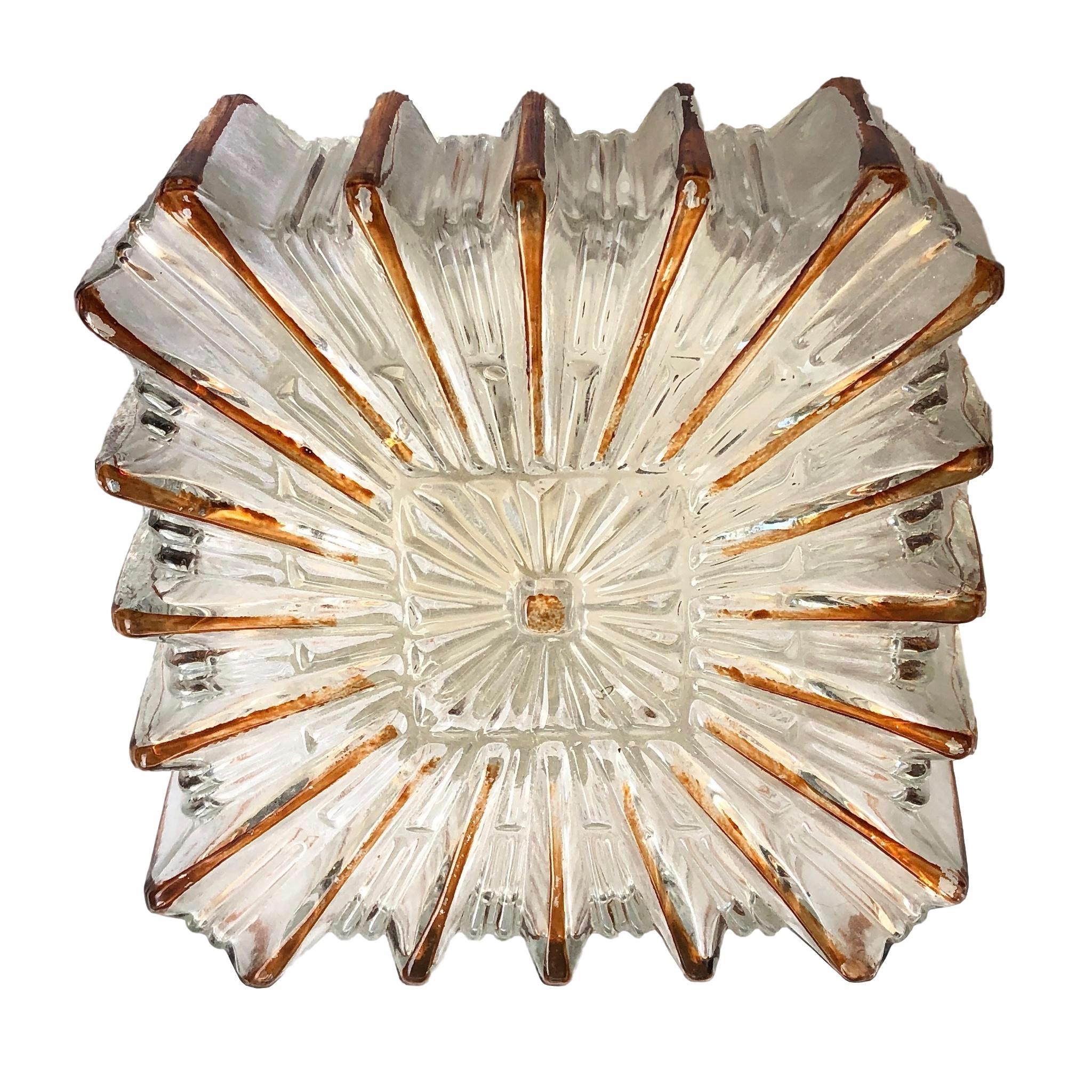 Petite starburst pattern flush mount. Made in Germany by Glashuette Limburg. Gorgeous textured glass flush mount with metal fixture. The Fixture requires one European E27 / 110 Volt Edison bulb, up to 60 watts.
