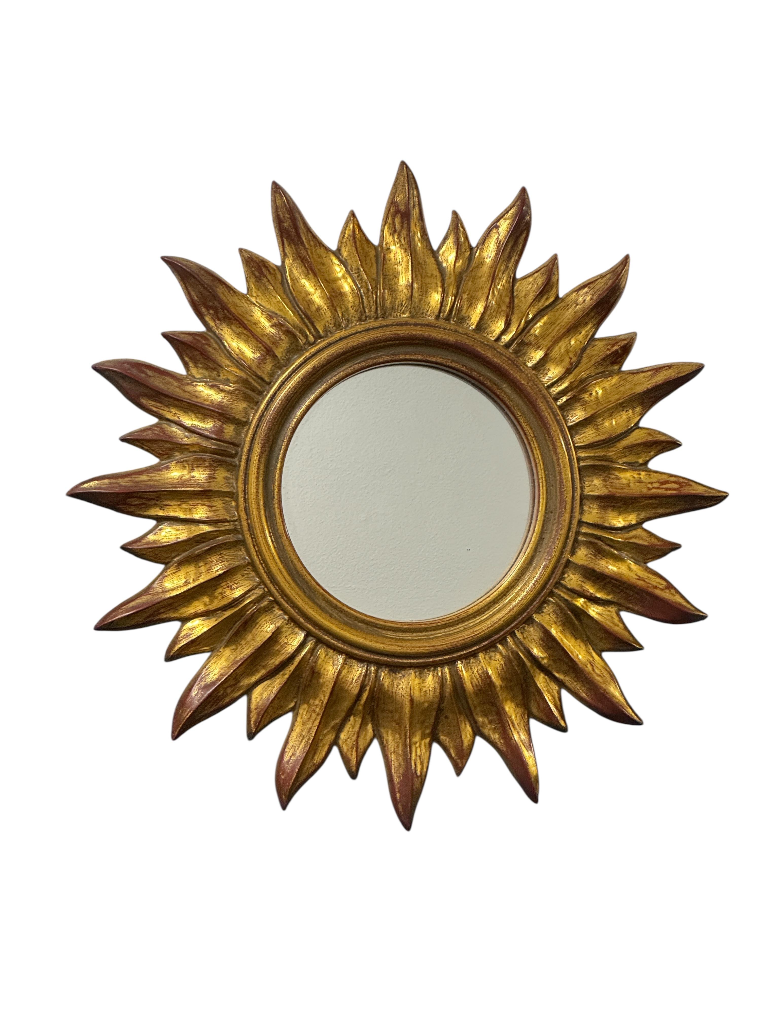 A gorgeous petite starburst flat mirror. Made of gilded Resin. No chips, no cracks, no repairs. It measures approximate: 14 3/8