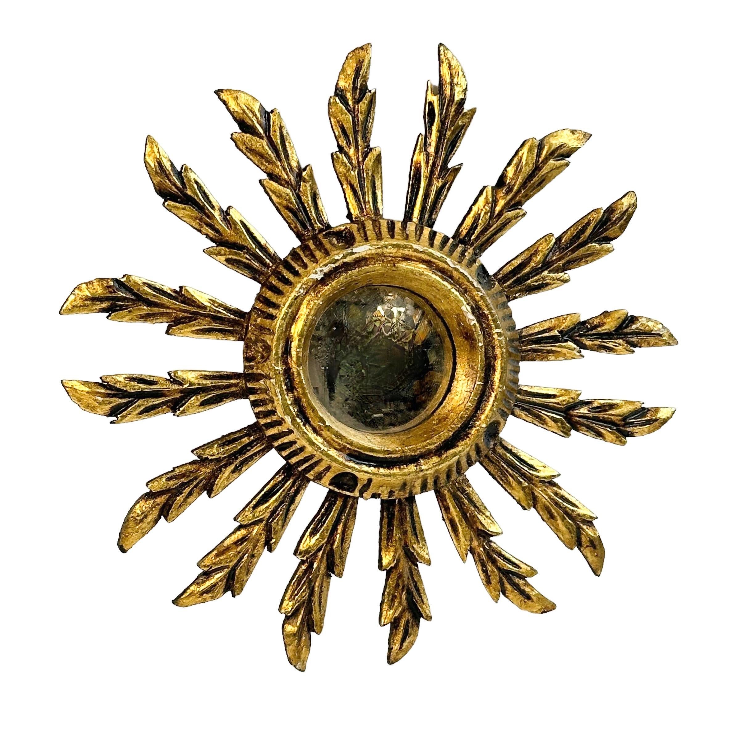 A gorgeous starburst sunburst convex mirror. Made of gilded wood. No chips, no cracks, no repairs. It measures approximate: 11.13