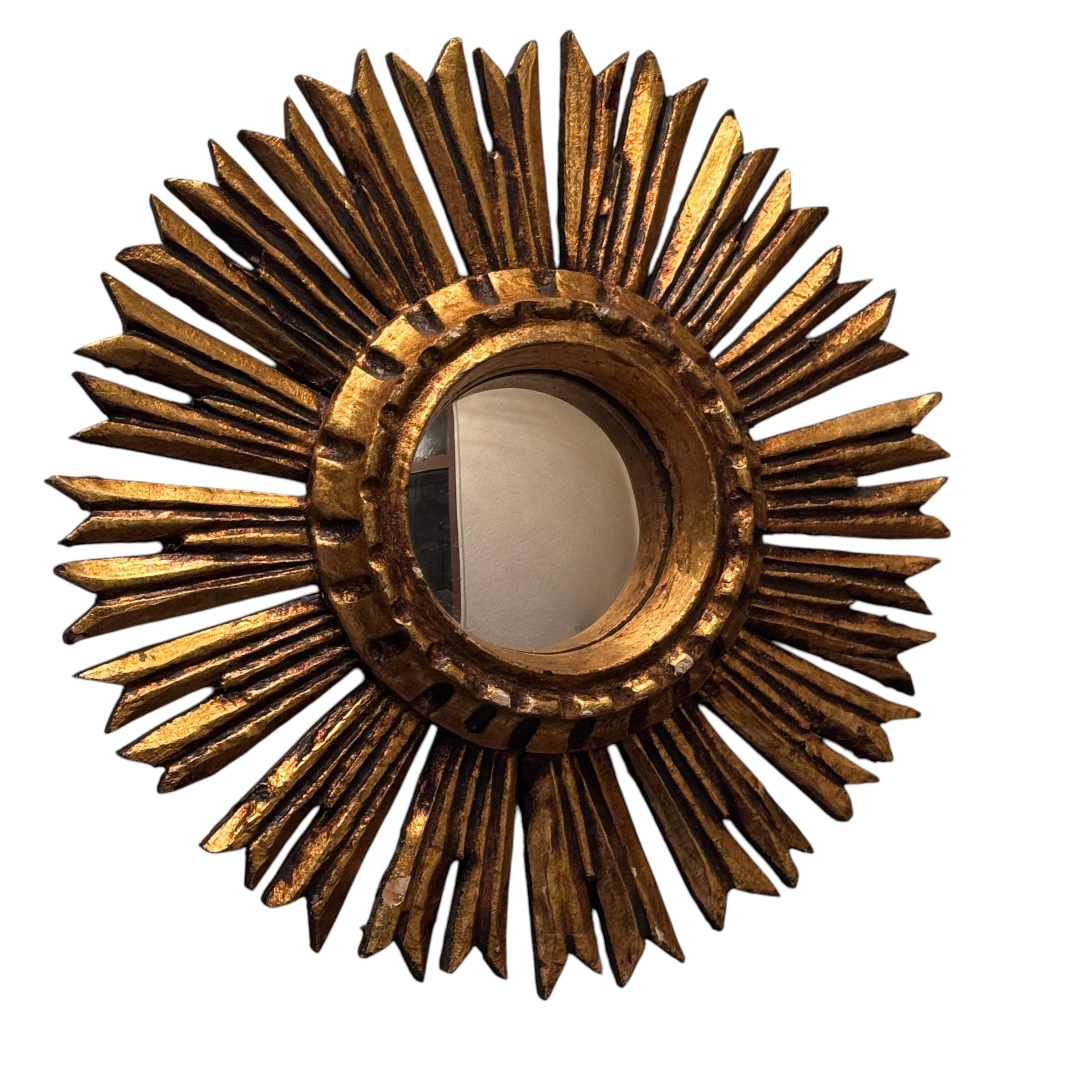 A gorgeous starburst sunburst convex mirror. Made of gilded wood. No chips, no cracks, no repairs. It measures approximate: 11 1/4